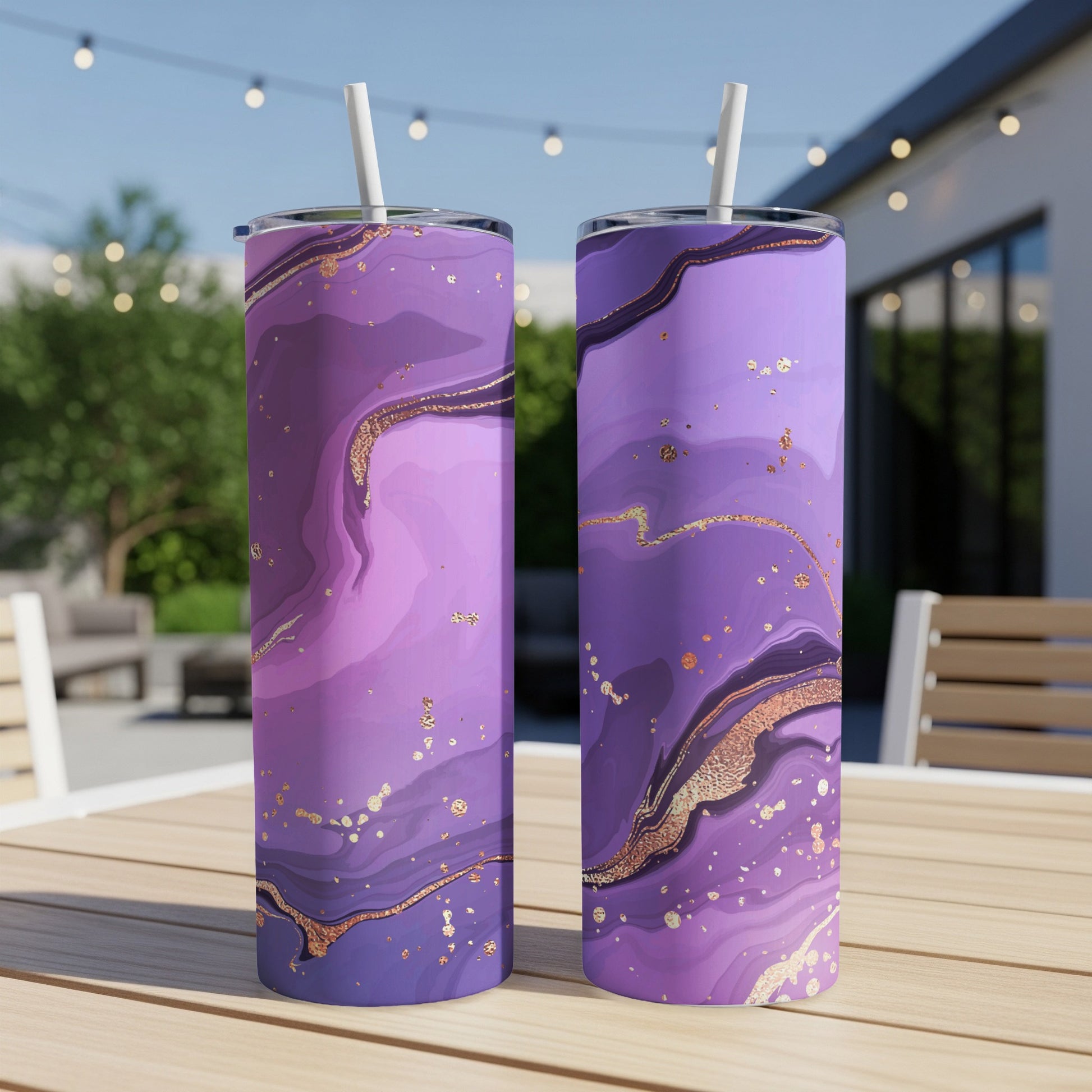 Two tall tumblers with purple marble design and gold accents.
