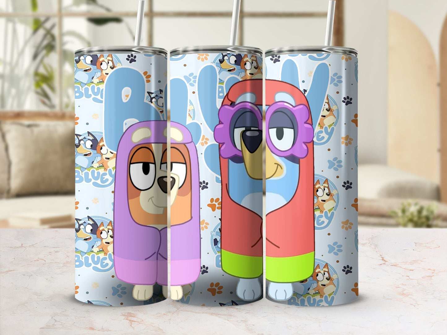 Bluey and Bingo characters on a light blue tumbler with straws.