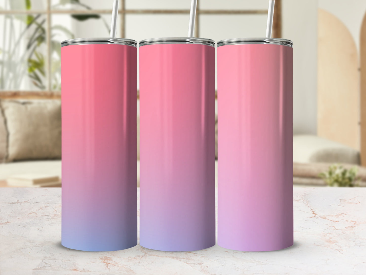 Three tumblers with pink and purple ombre gradient and silver straws