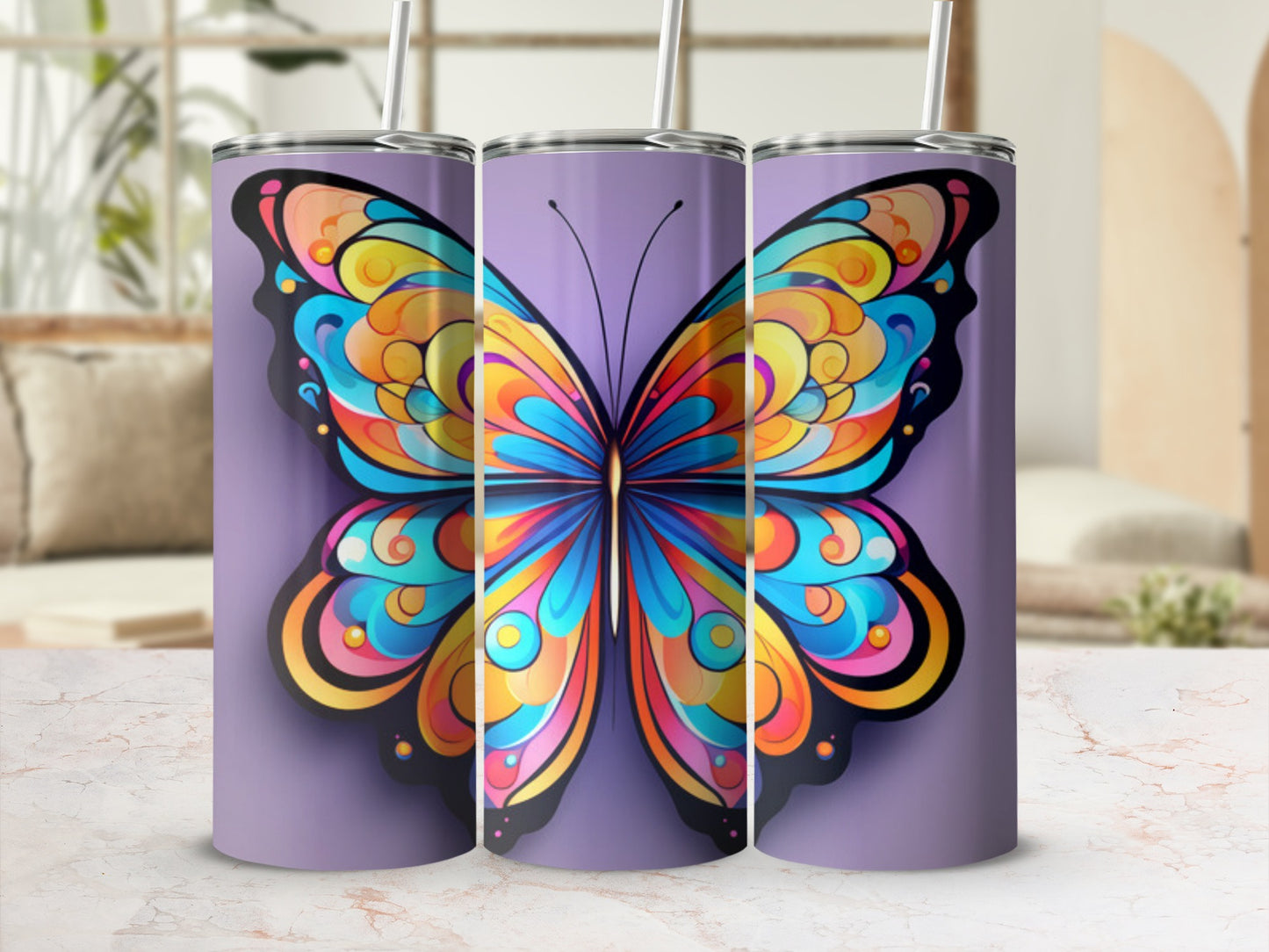 Tall tumbler with colorful butterfly design and straw.