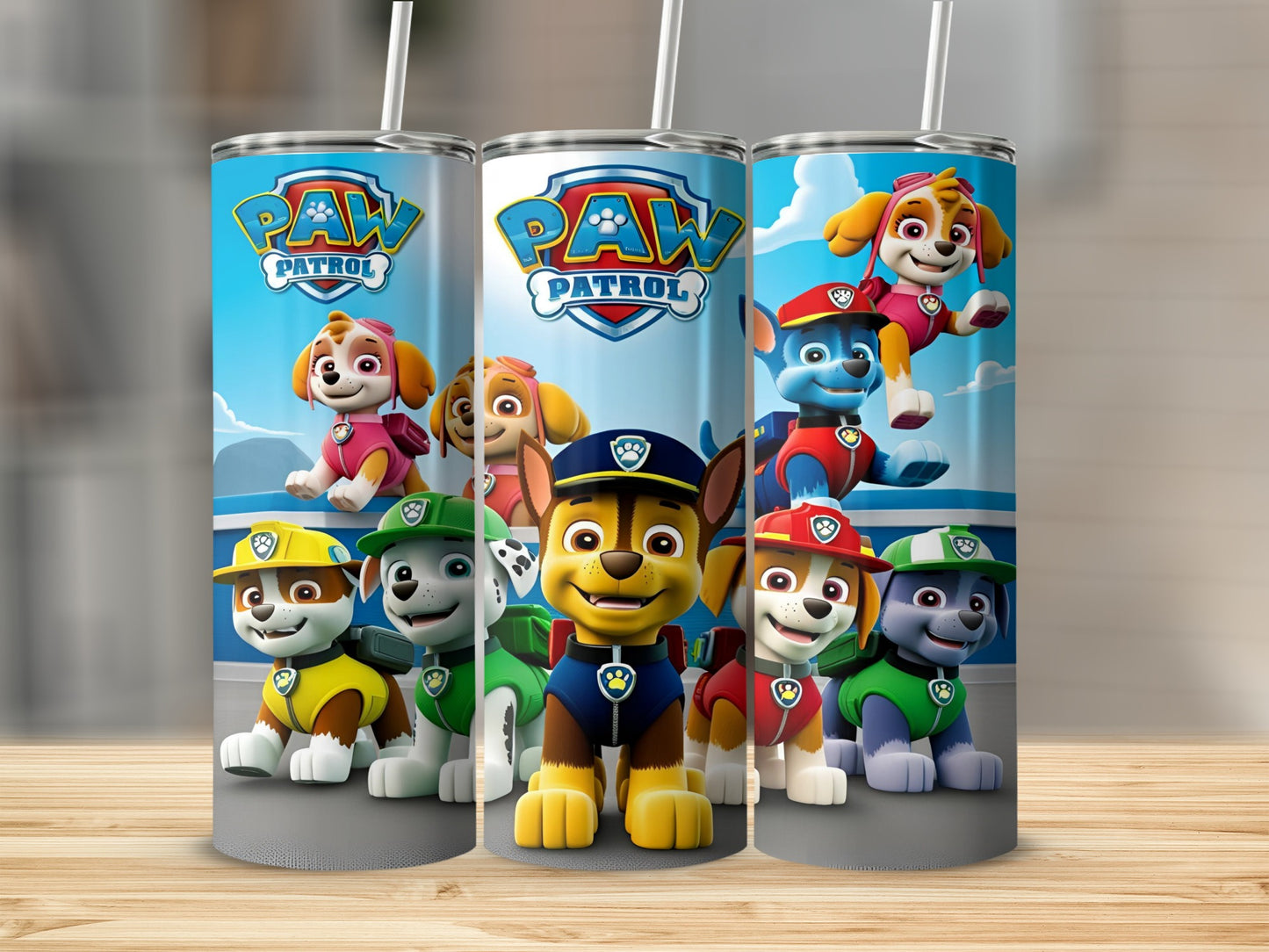 Paw Patrol pups Chase, Marshall, Rubble, Skye, and Everest on a blue tumbler.