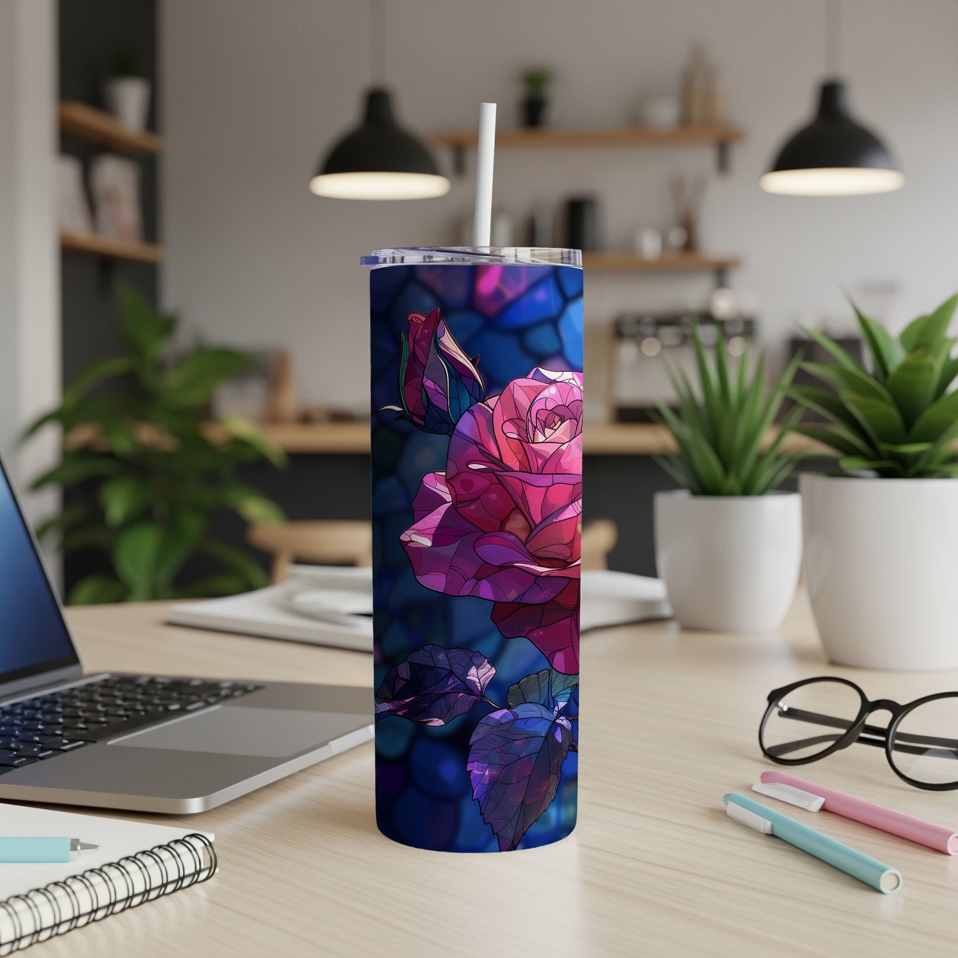 Tall tumbler with a stained glass rose design and straw.
