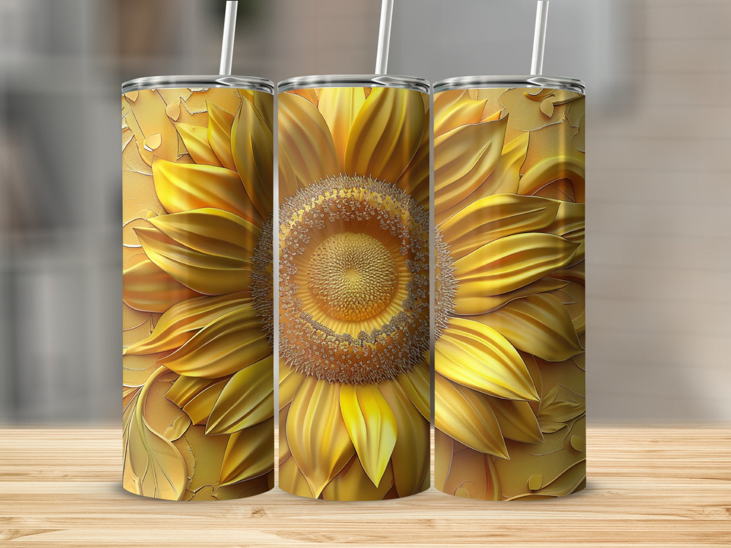 Three tumblers with a detailed sunflower design on a wooden surface.