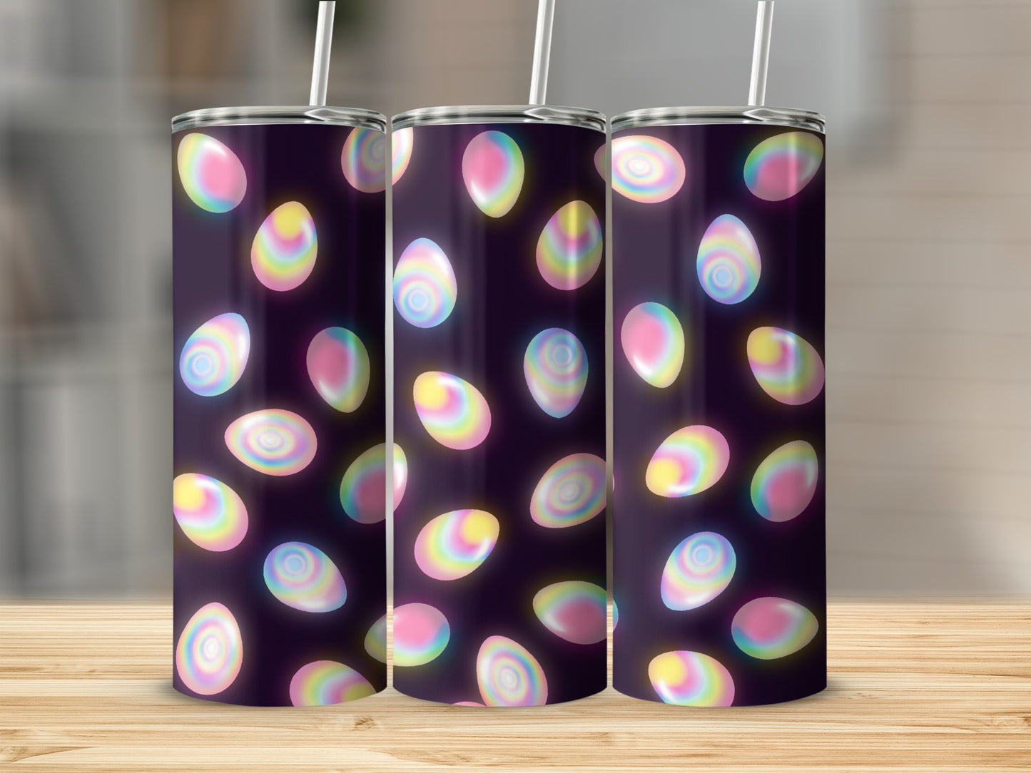 Tumblers with glowing, colorful Easter egg pattern against a dark background.