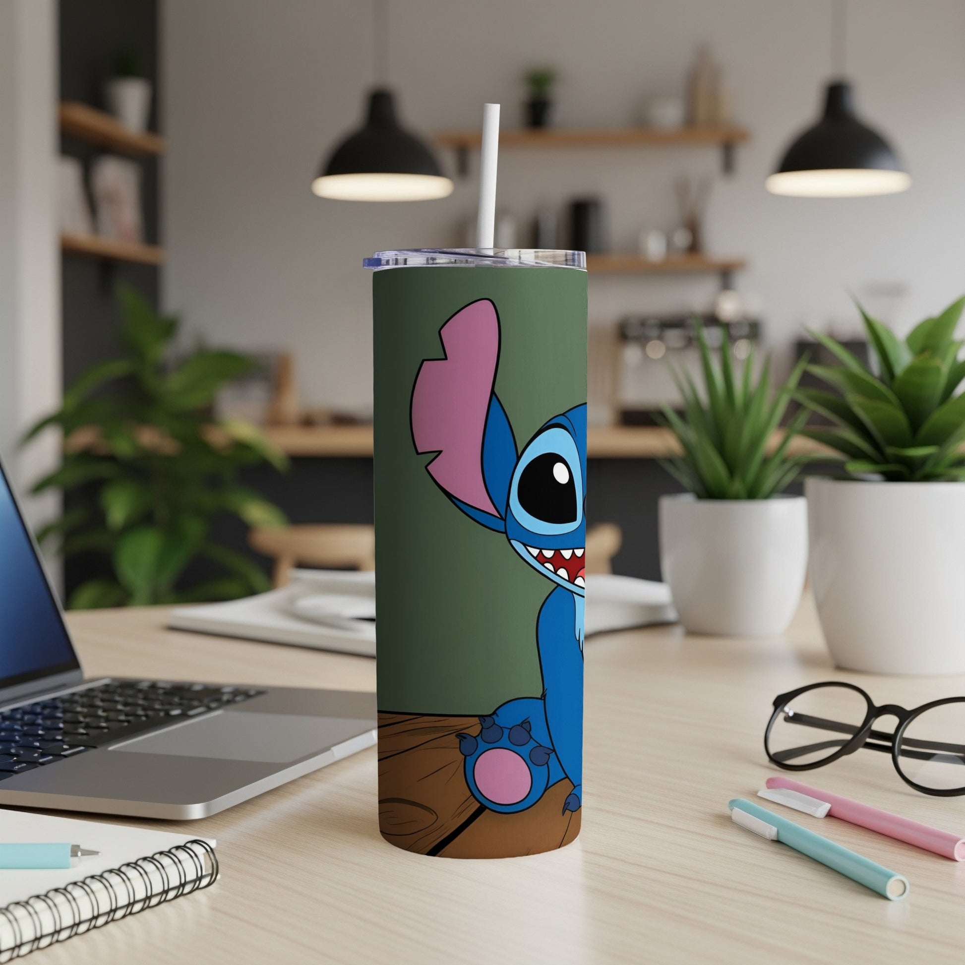 Stitch cartoon character on a green tumbler with a wooden desk background.