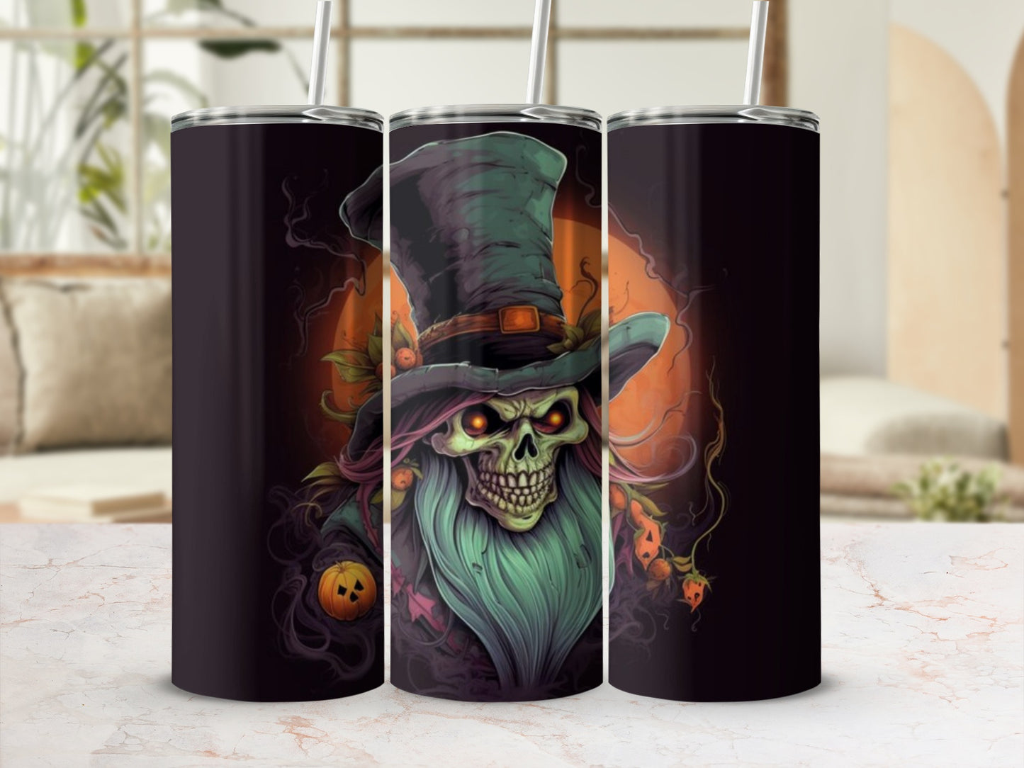 Three tumblers featuring a spooky skull with a green hat and orange eyes.