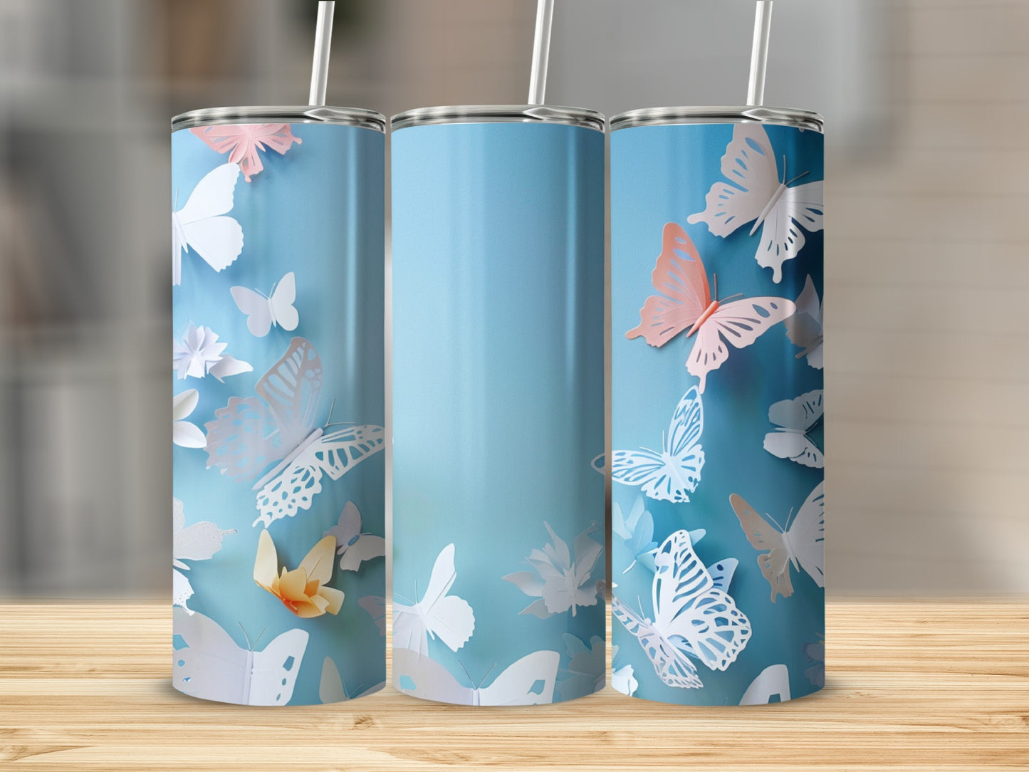 Three tall, blue tumblers with white and pink butterflies.