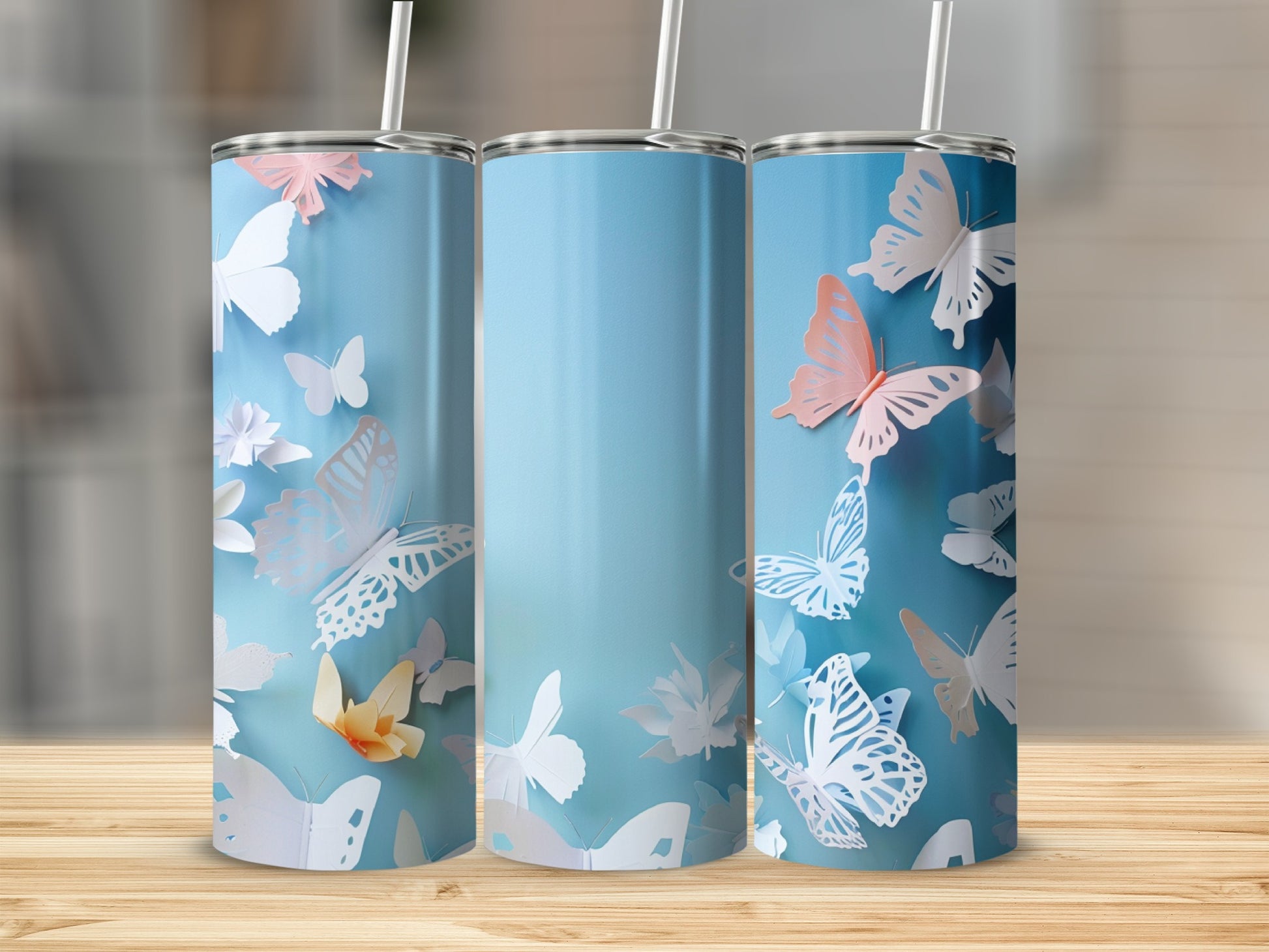 Three tall, blue tumblers with white and pink butterflies.