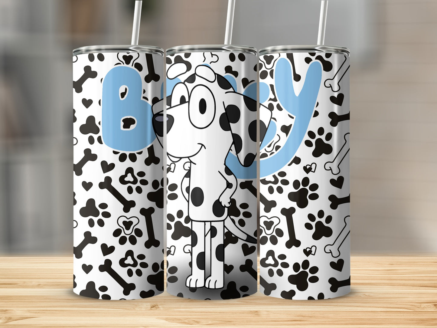Three tumblers with a cartoon dog and "Boy" text on a wooden surface.