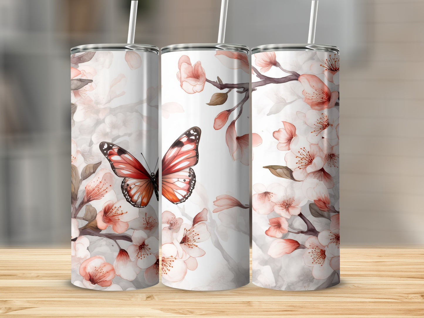 Three tumblers with butterfly and cherry blossom floral design.