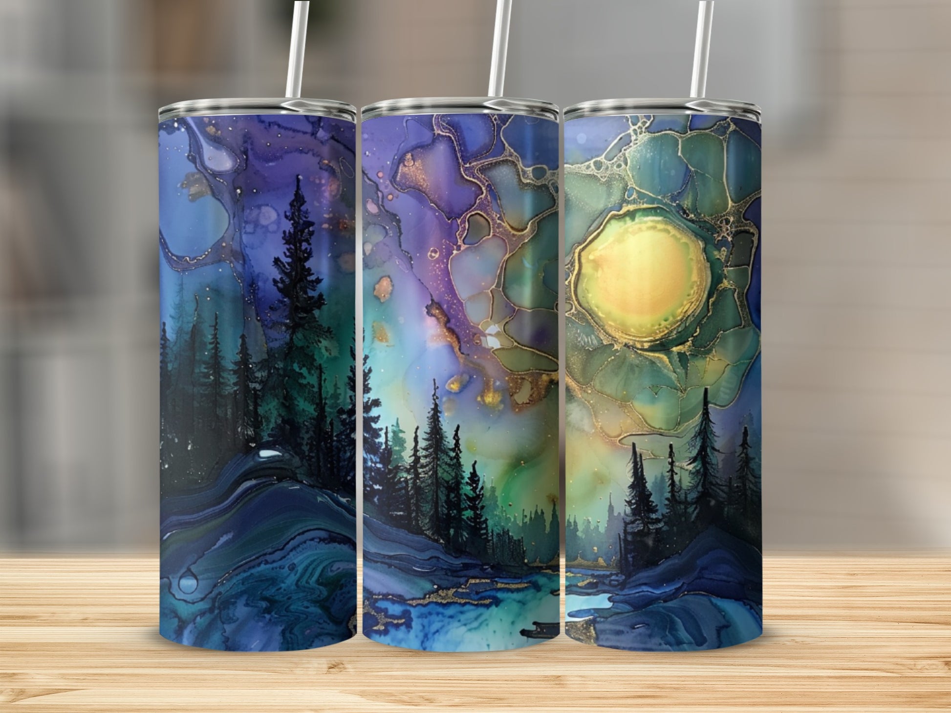 Three tumblers with abstract forest and moon landscape designs.