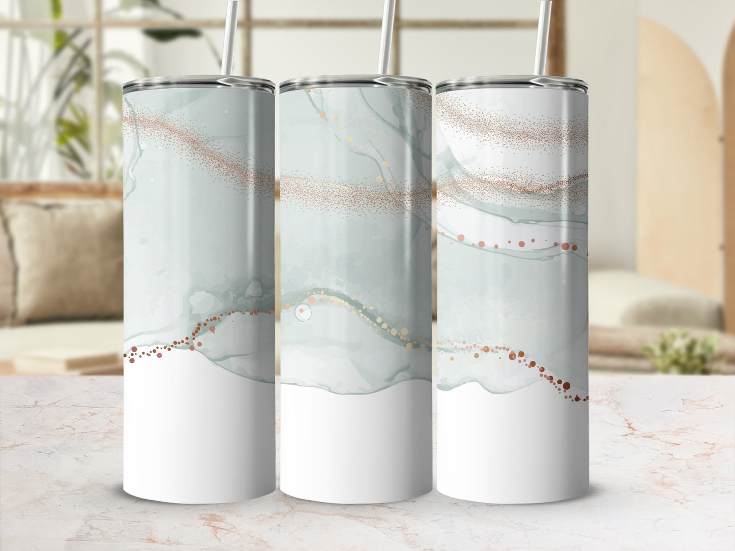 Three tumblers with a marbled watercolor design featuring gold glitter accents.