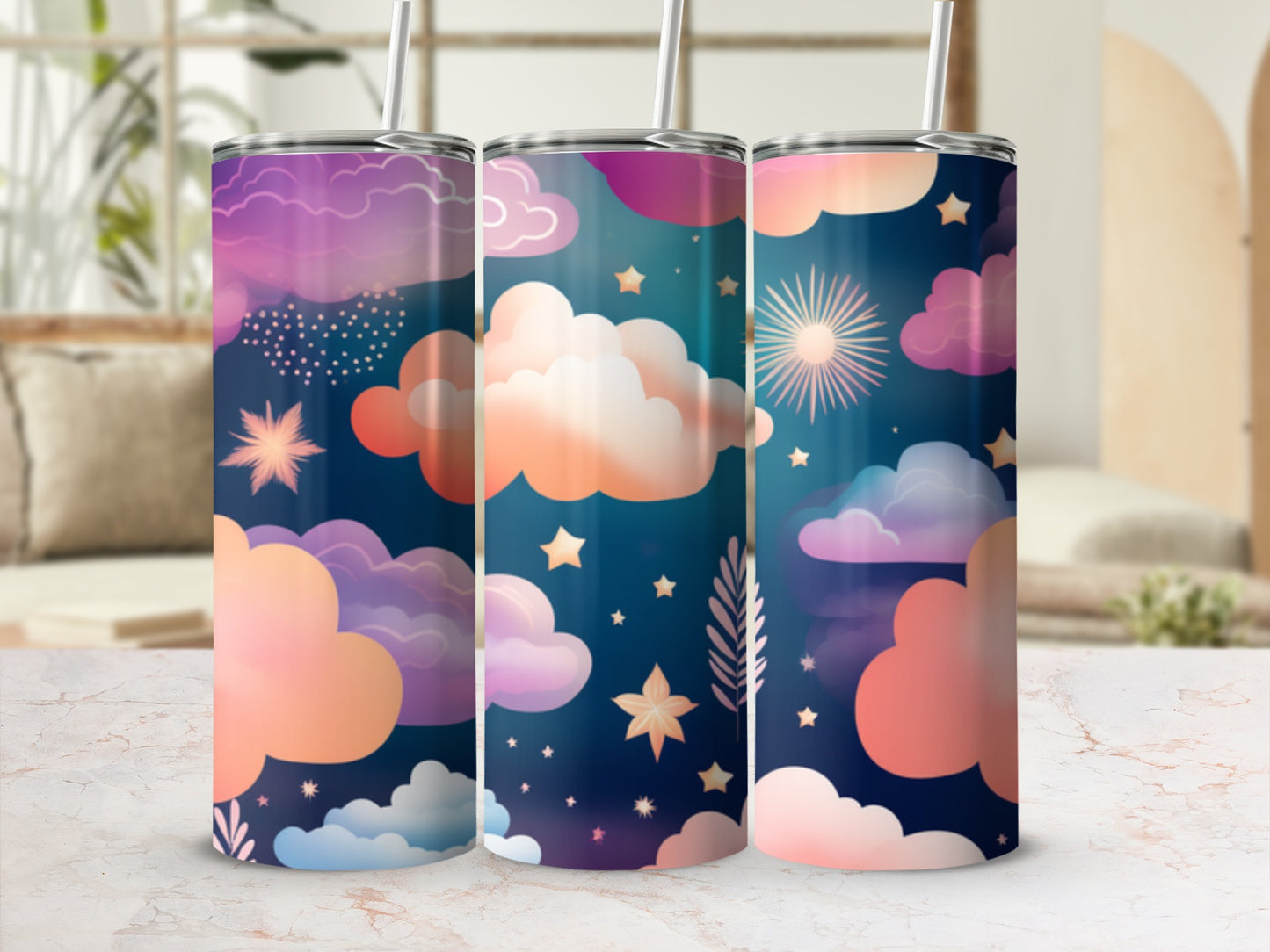 Three tumblers with a starry night and cloud pattern on a marble surface.