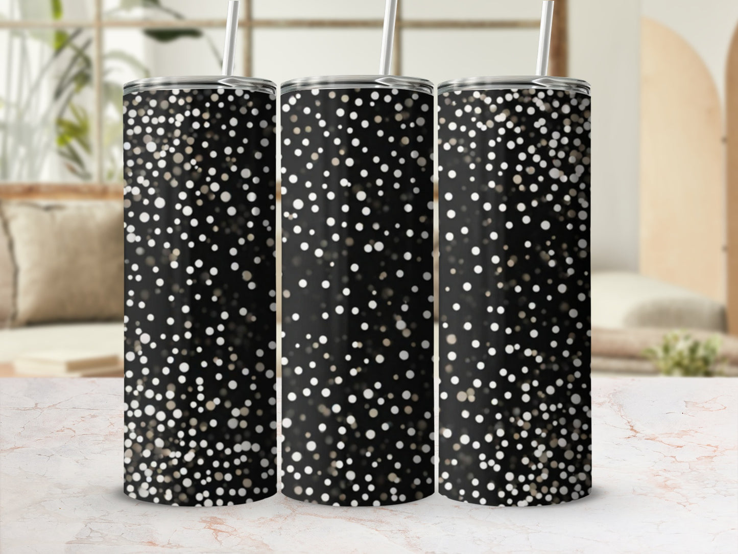 Three black tumblers with a scattered white and gold glitter pattern.