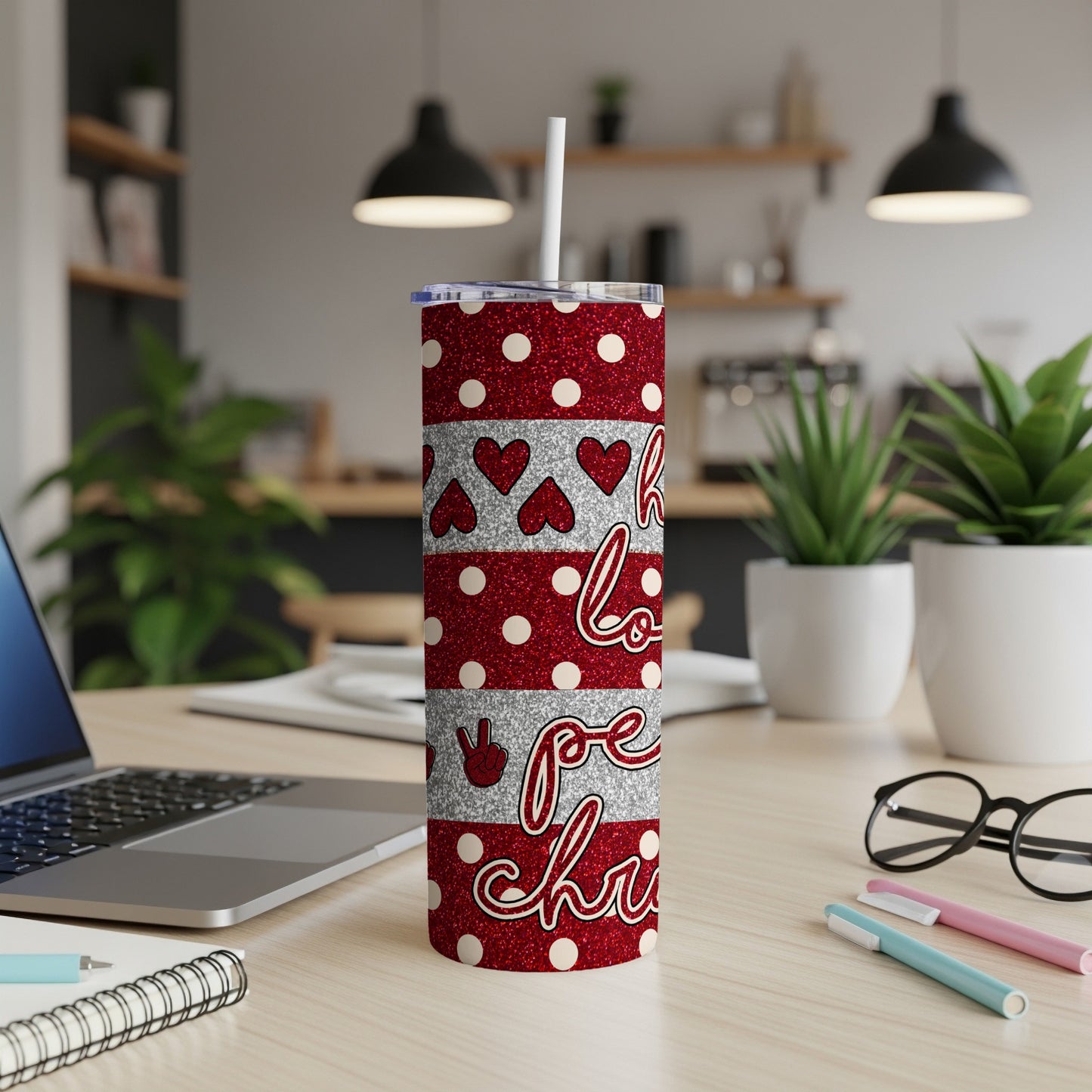 Red glitter tumbler with "love peace joy" text and silver hearts.