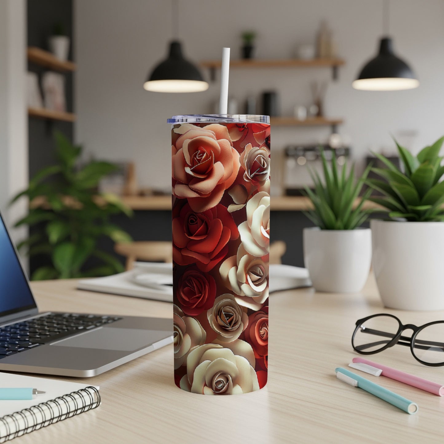 Tumbler with a repeating pattern of red and cream roses.