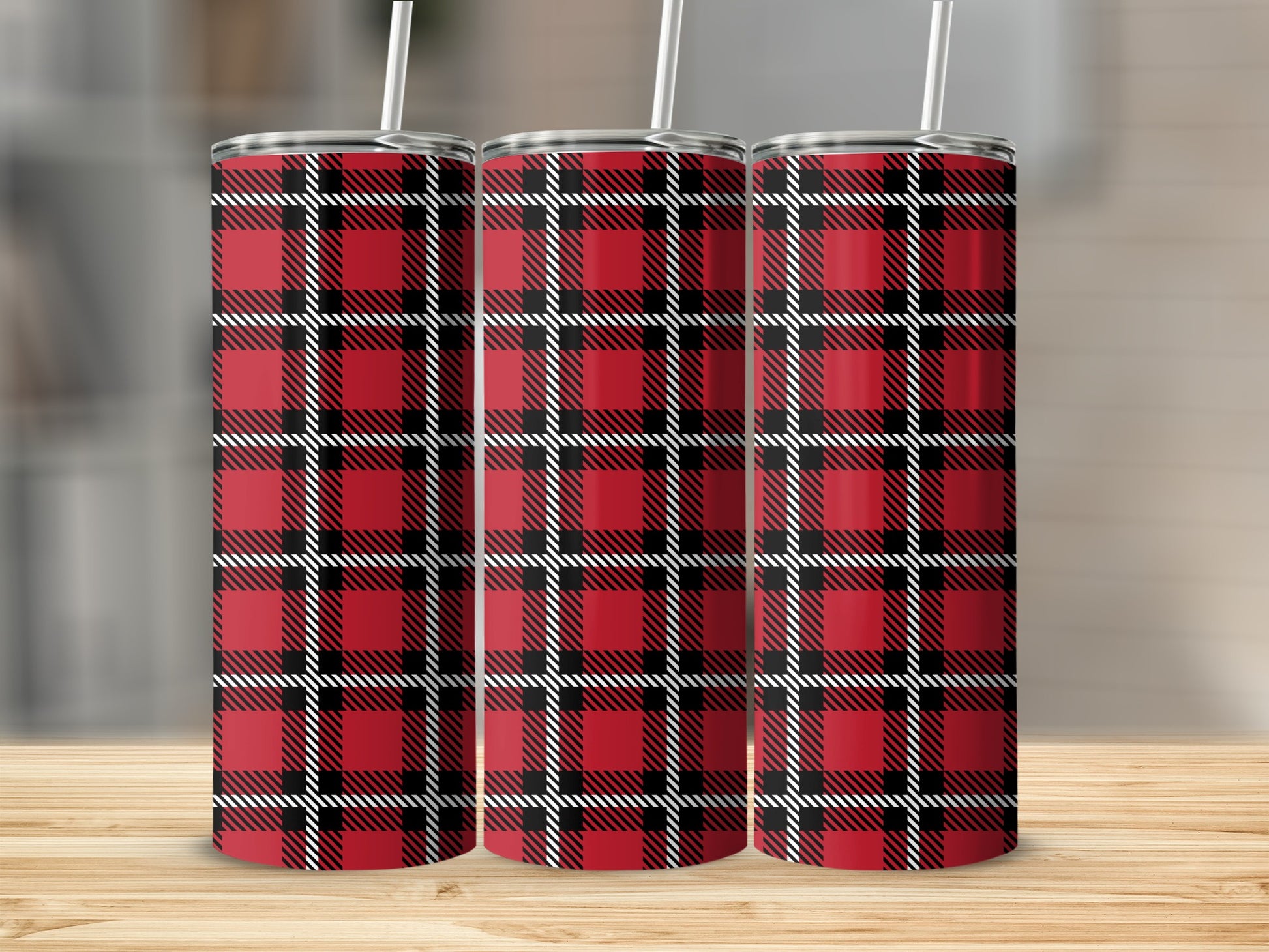 Three tumblers with red, black, and white plaid pattern and straws.