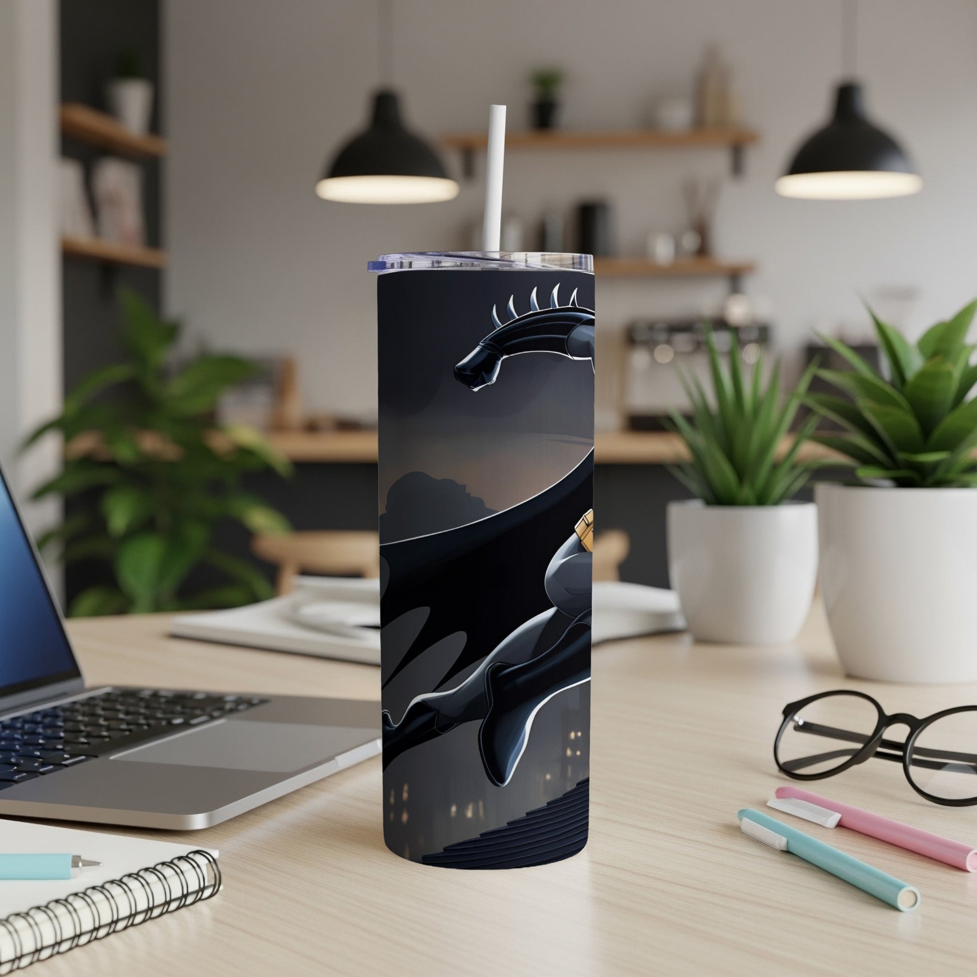 Black dragon design on a tall tumbler with a white straw.