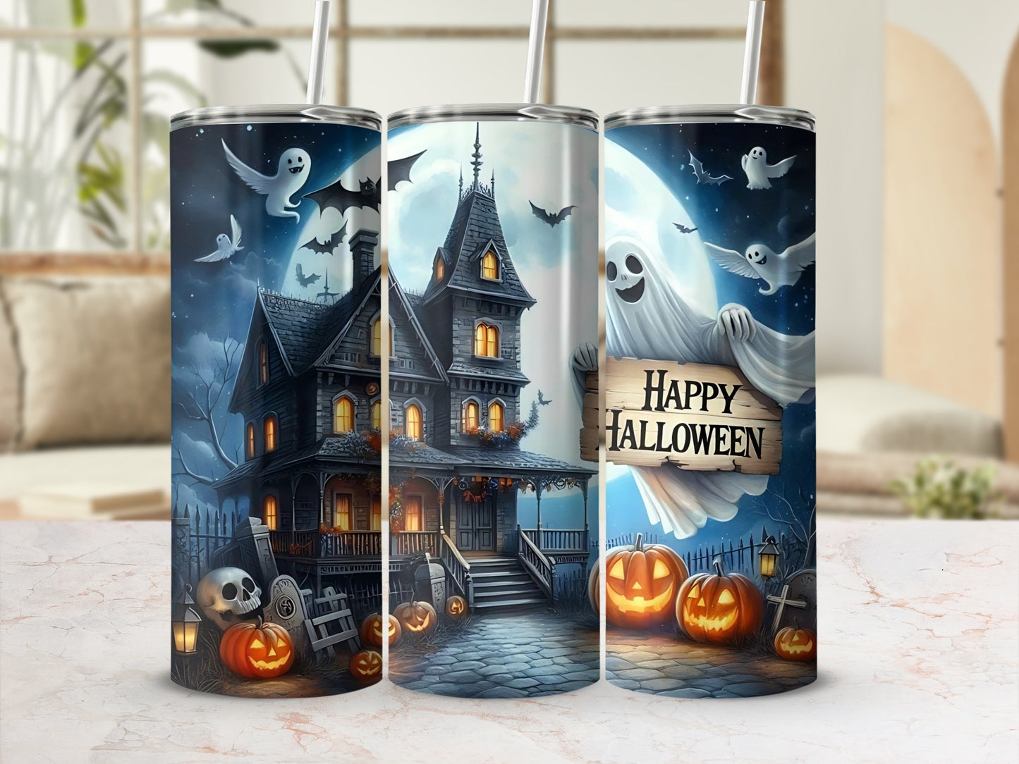 Three tumblers with a spooky haunted house and happy Halloween ghost design.