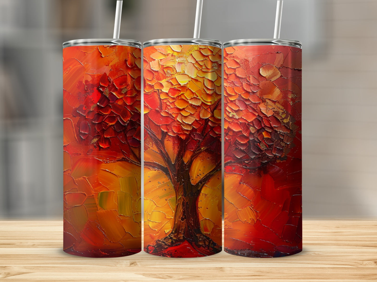 Textured abstract tree art on three cylindrical tumblers with straws.