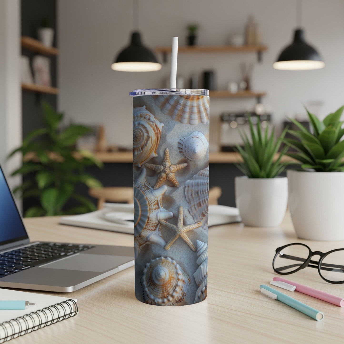 Seashells and starfishes pattern on a white tumbler with a straw.