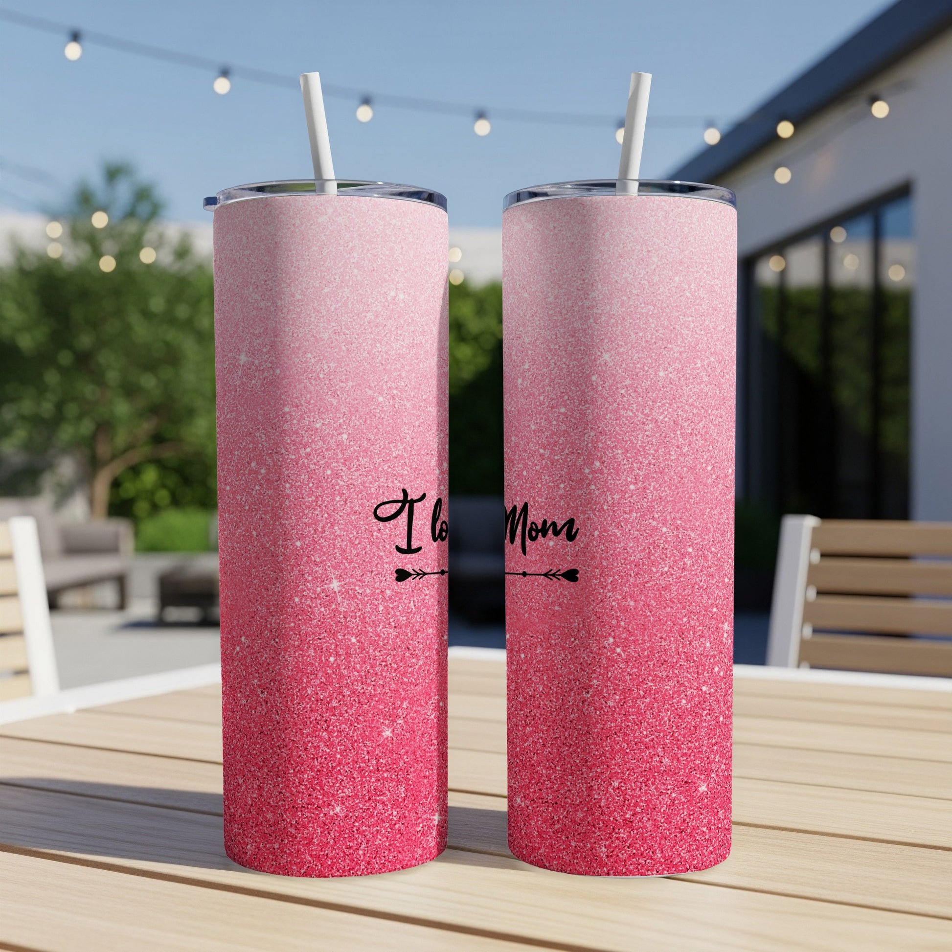 Two pink glitter tumblers with "I Love Mom" text on the left tumbler.