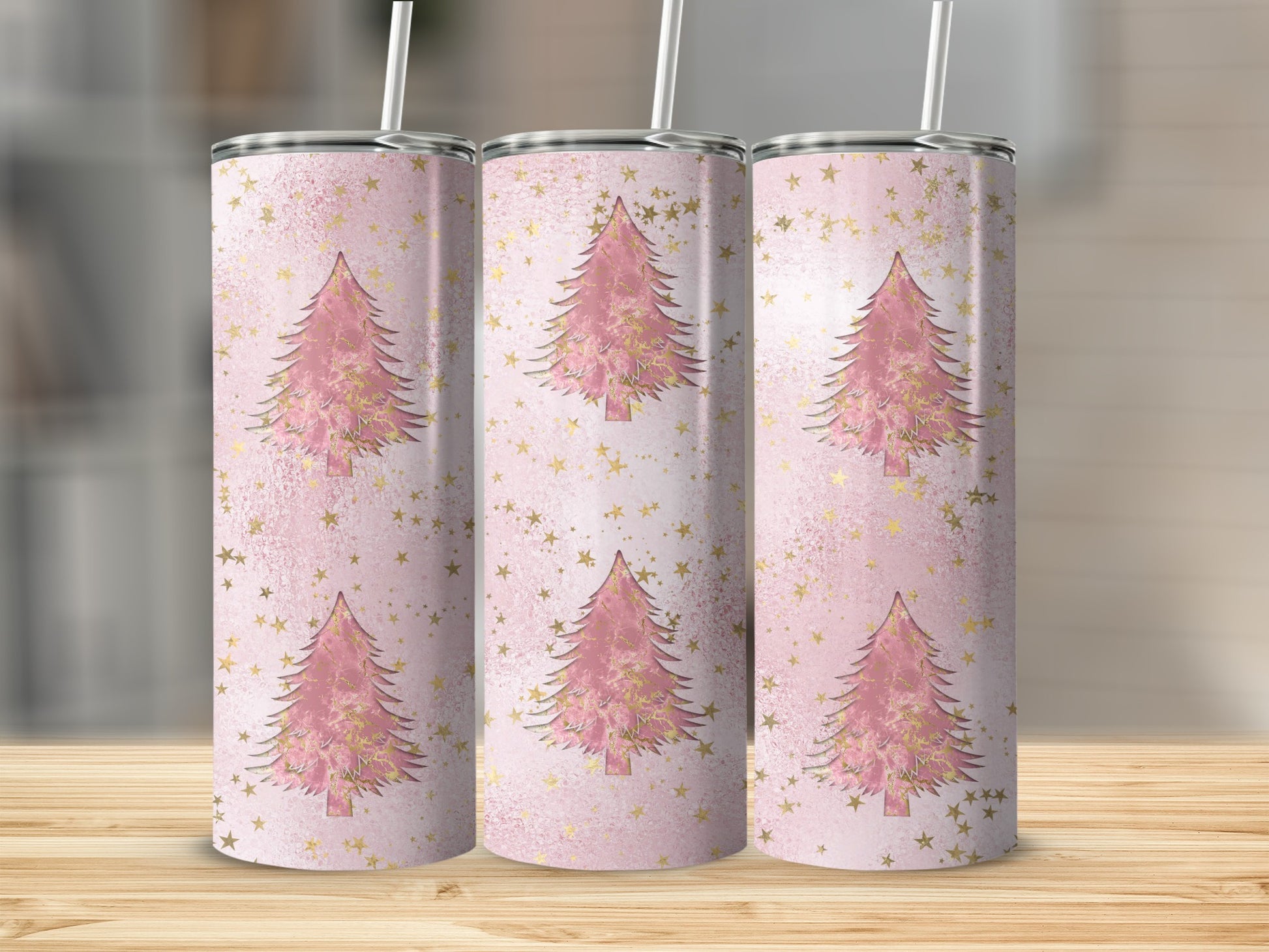 Three pink Christmas trees with gold stars on a textured background.
