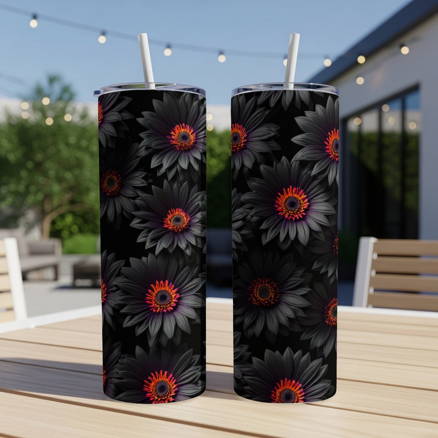 Two tumblers with black daisy floral patterns and orange centers.