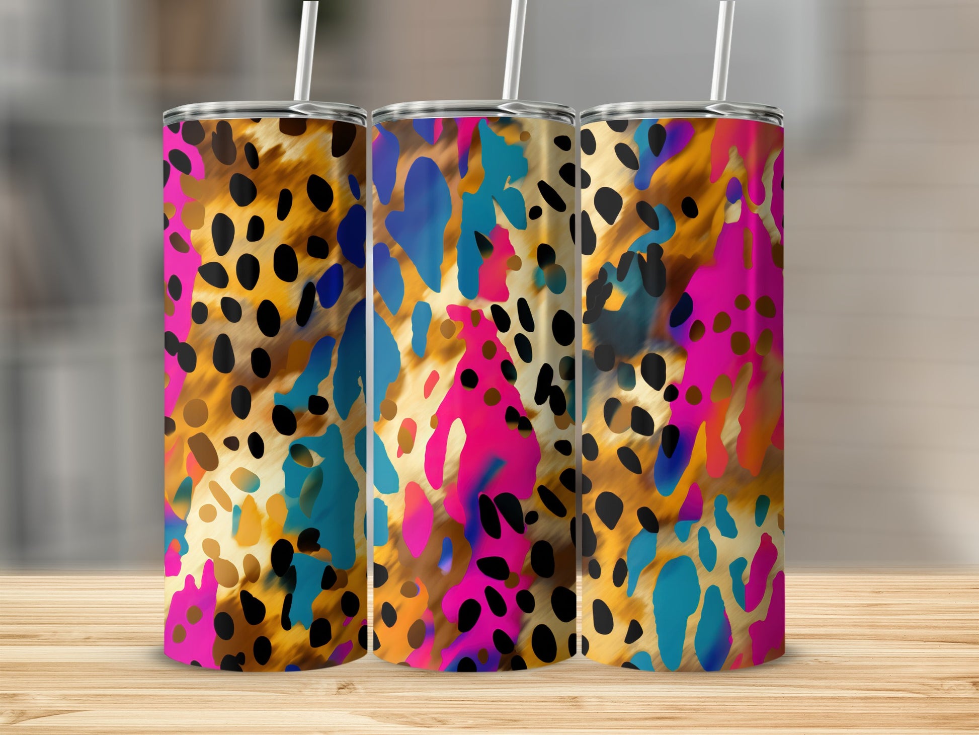 Three tumblers with a colorful leopard print design.
