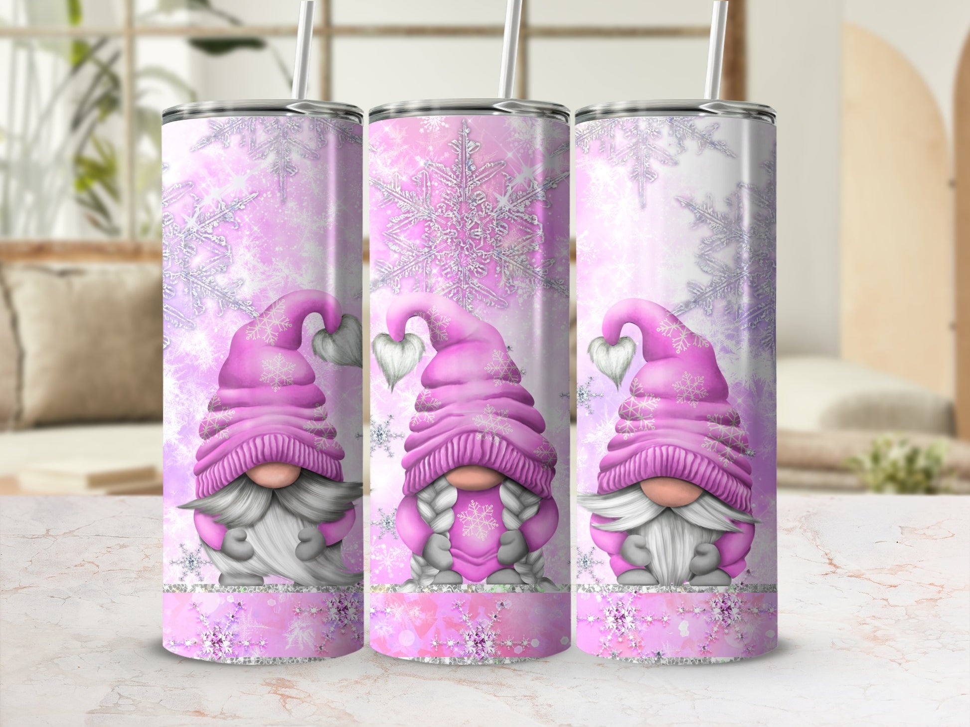 Pink gnomes with snowflakes on a tumbler.