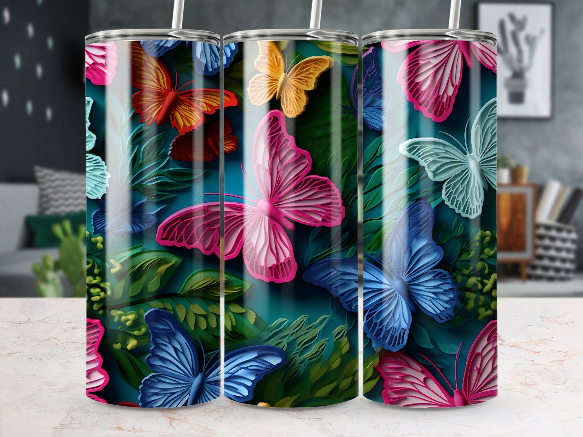 Three tumblers featuring colorful butterflies and foliage.