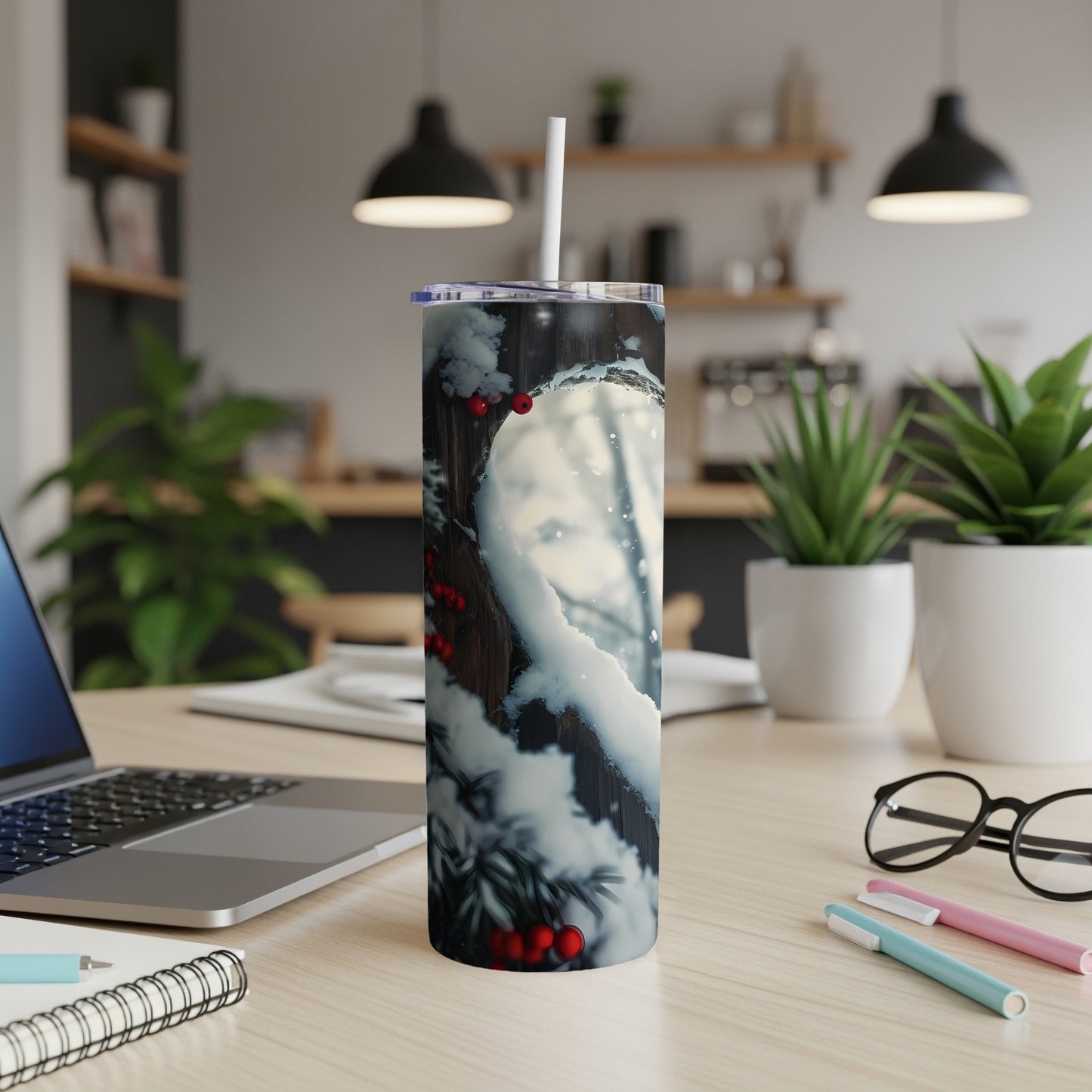 Snowy pine branch with red berries on a white tumbler with a straw.