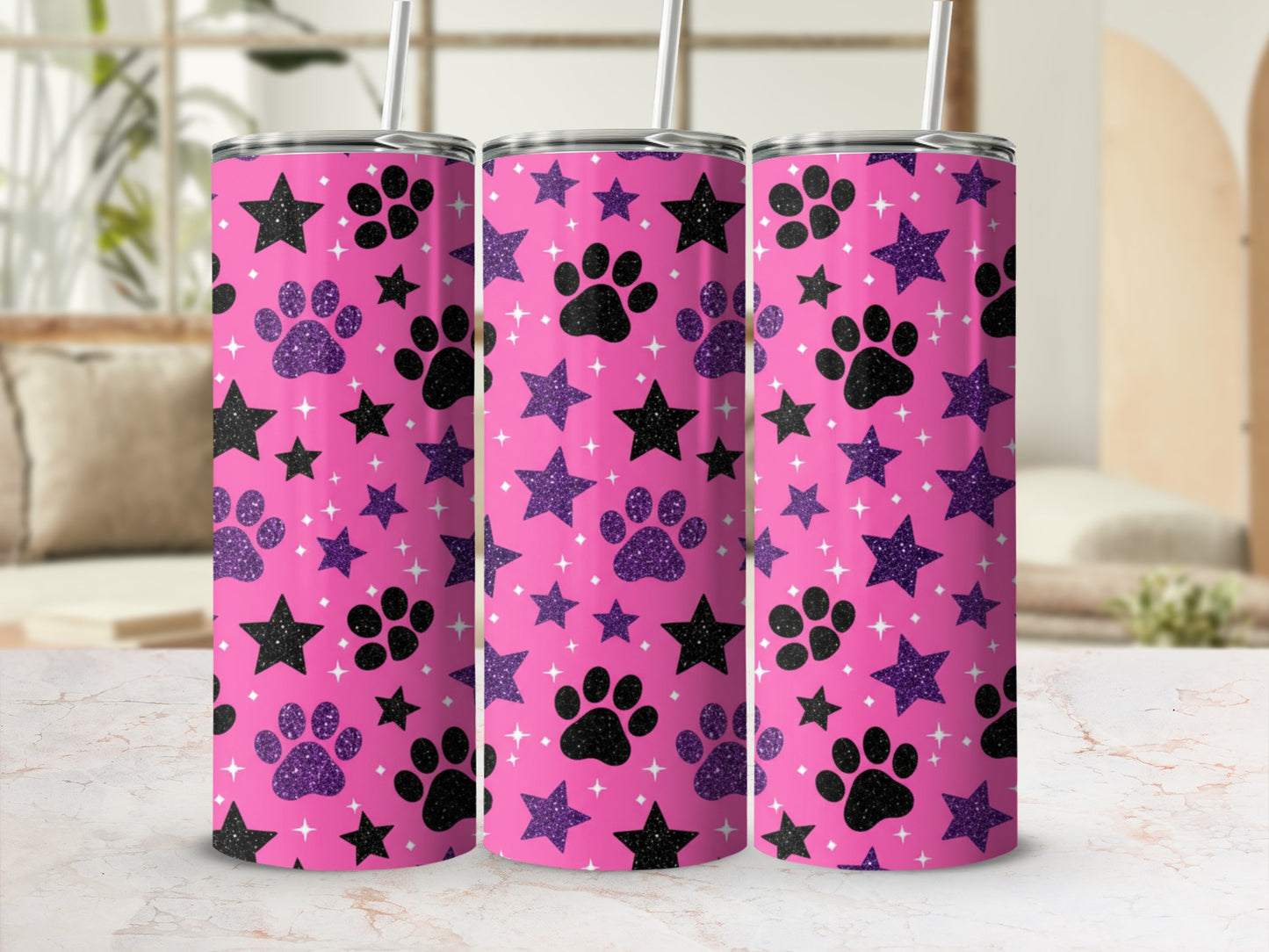 Pink tumbler with black paw prints and glitter stars pattern.