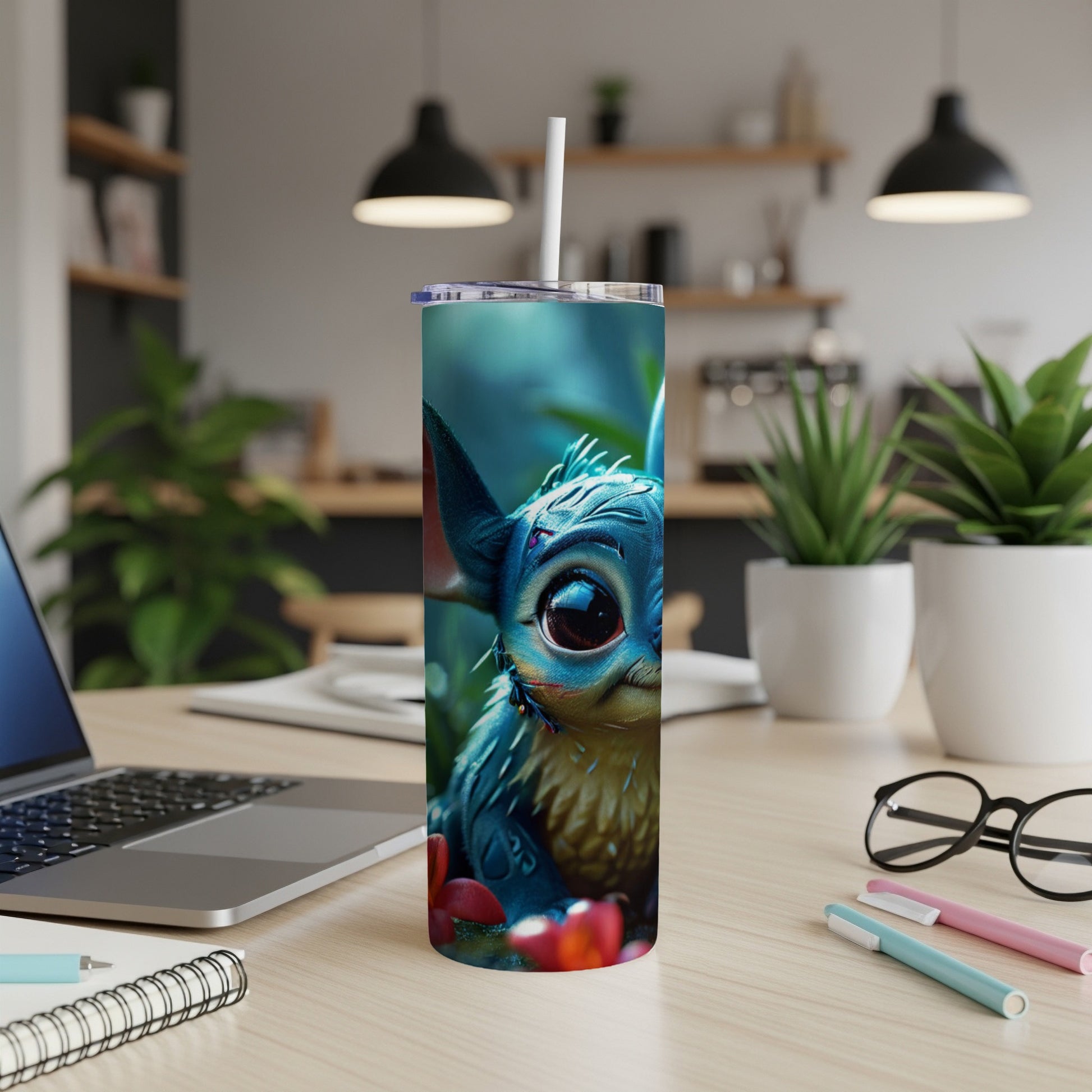 Furry blue creature with large eyes on a tumbler with a straw.