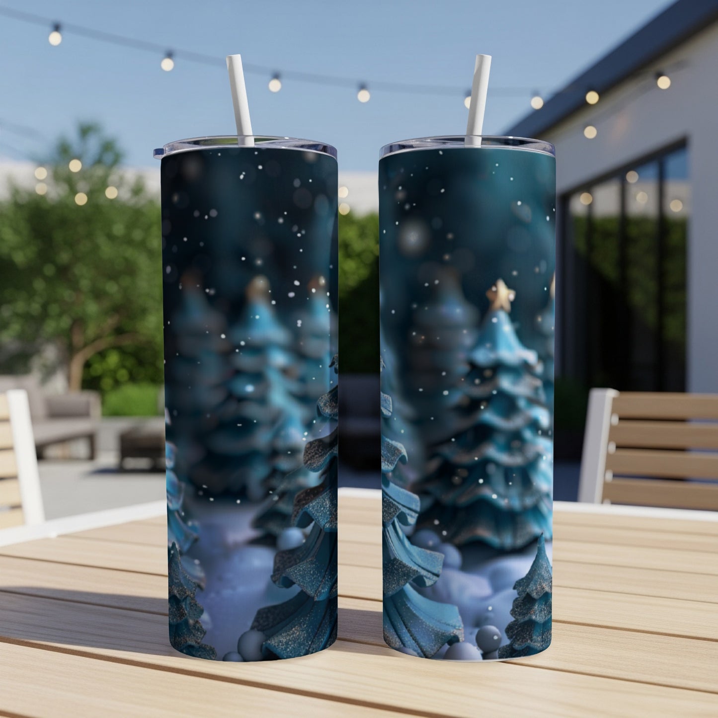Two tumblers with a festive Christmas tree design on an outdoor table.