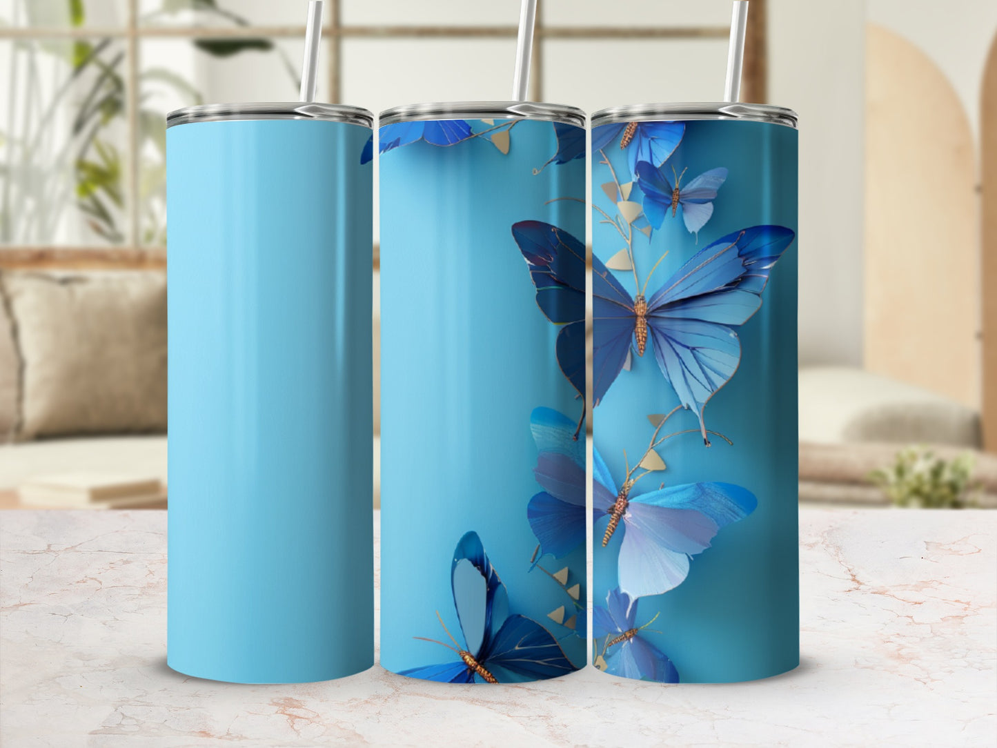 Blue tumbler with scattered blue butterflies and gold accents.