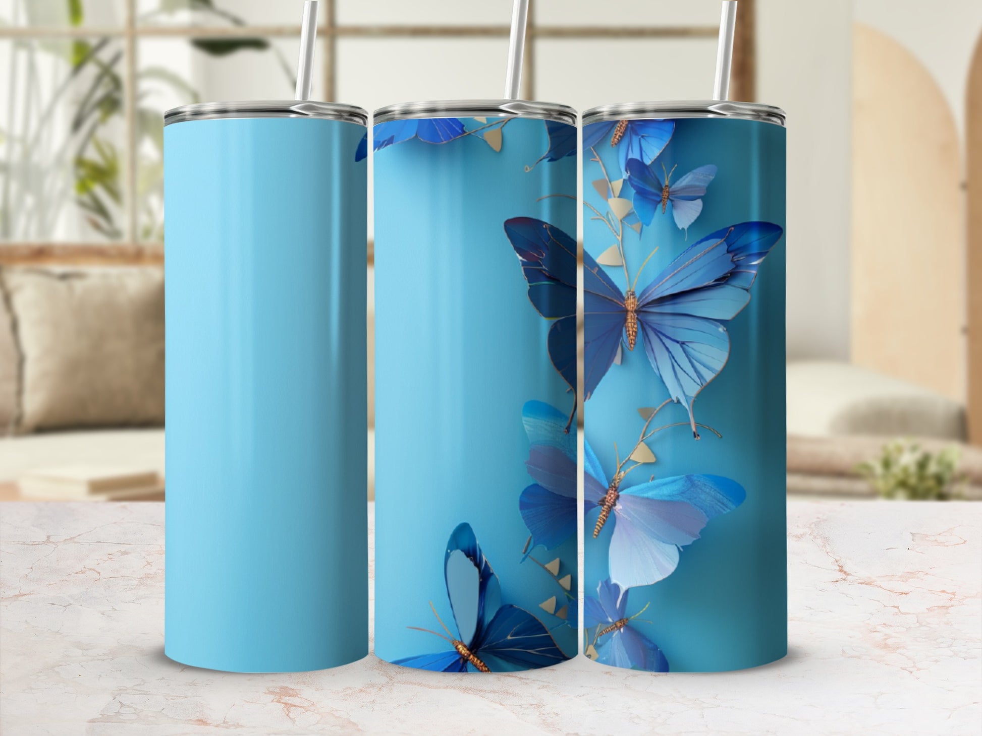 Blue tumbler with scattered blue butterflies and gold accents.