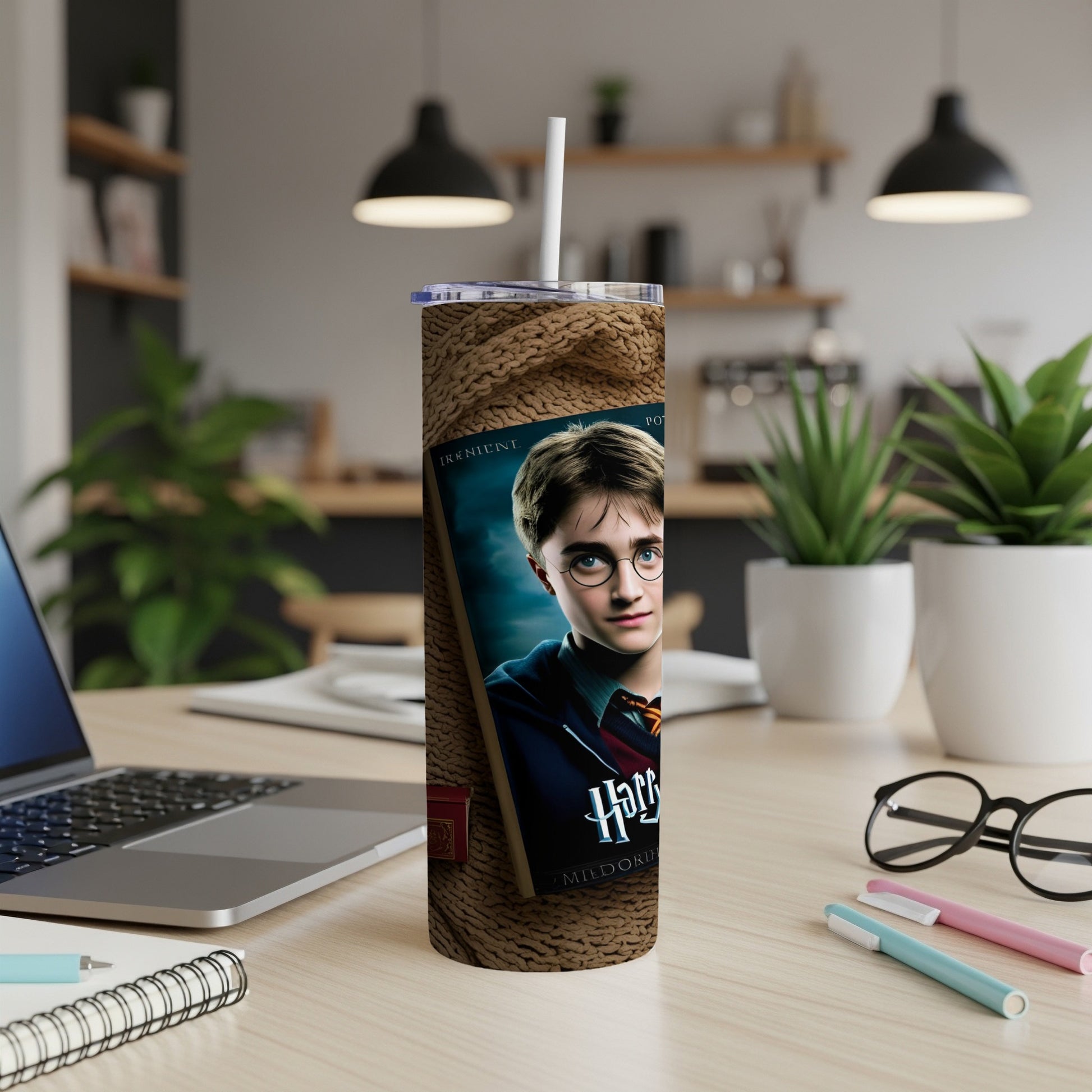 Harry Potter tumbler with straw, featuring Harry's portrait and text.