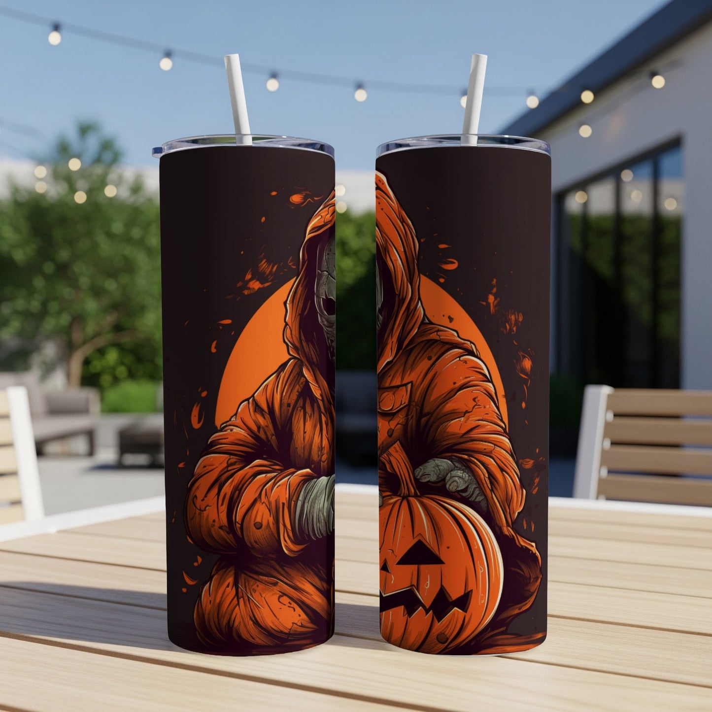 Two tumblers feature a Halloween design of a hooded figure holding a jack-o'-lantern.