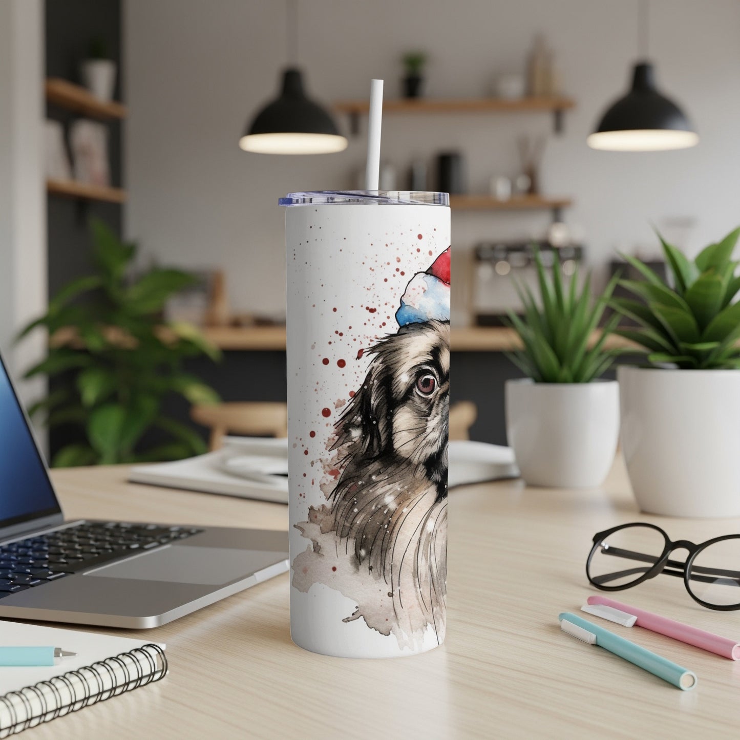 Watercolor painting of a dog in a Santa hat on a white tumbler.