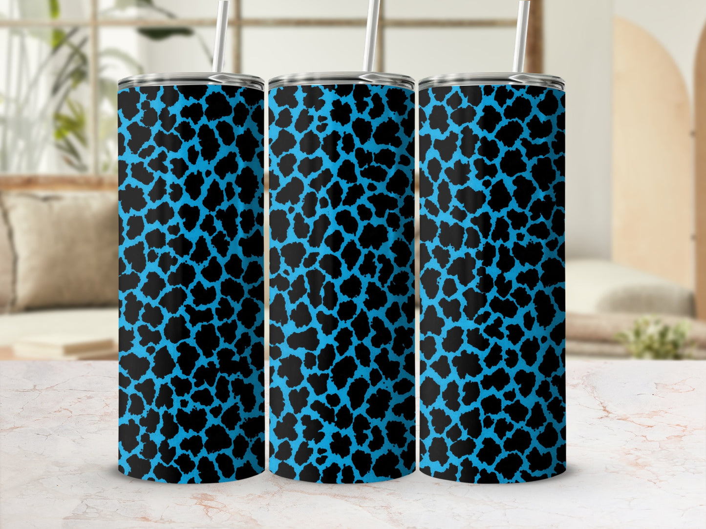 Three tumblers with blue and black leopard print pattern.