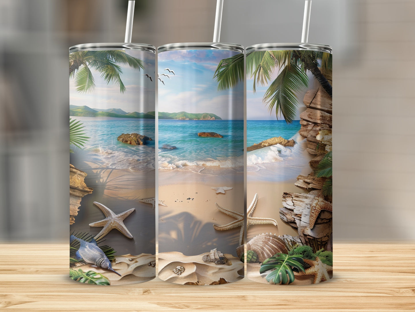 Three tumblers featuring a beach scene with palm trees, starfish, and seashells.