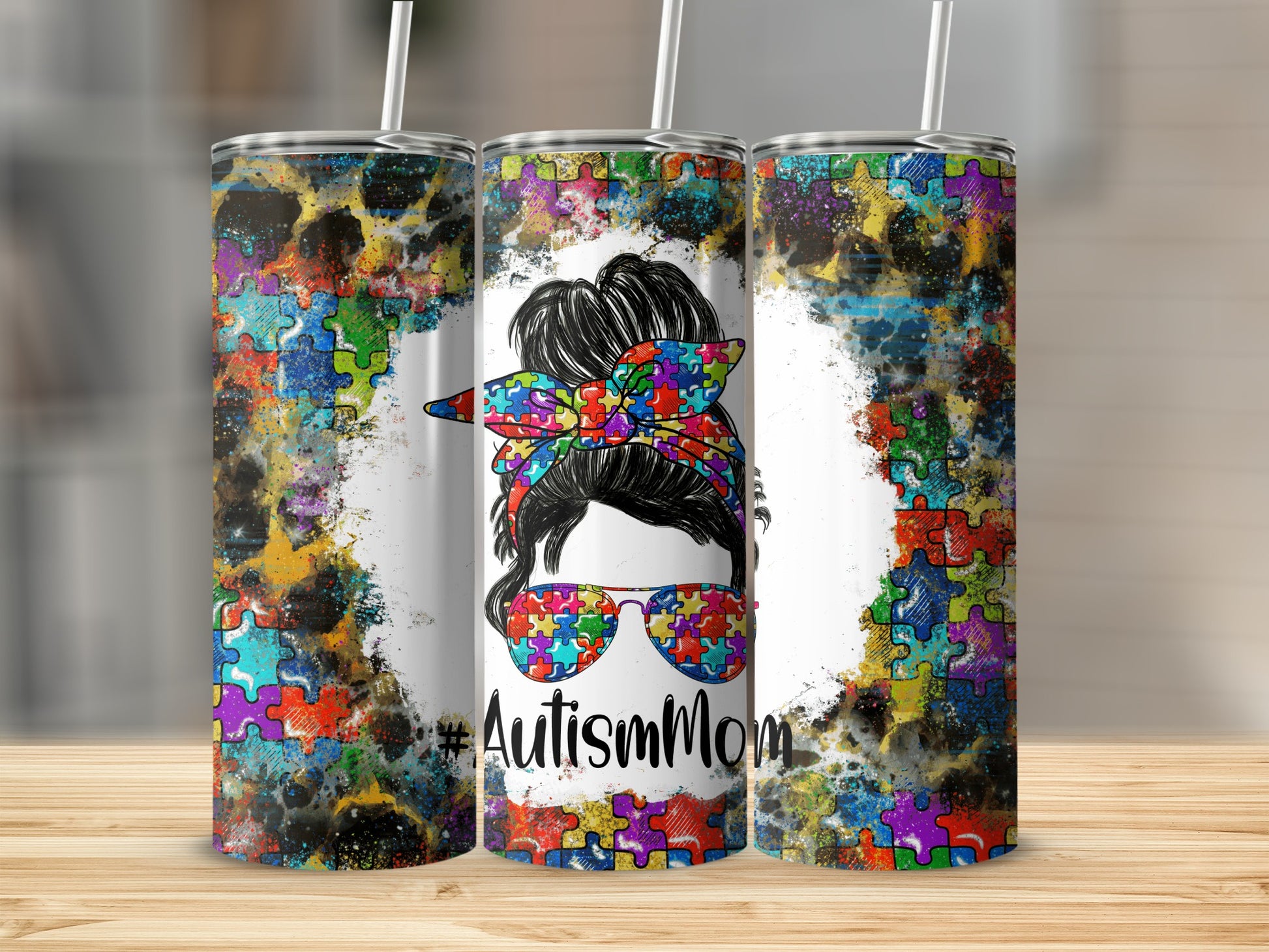 Tumbler with Autism Mom design and colorful puzzle pieces pattern.