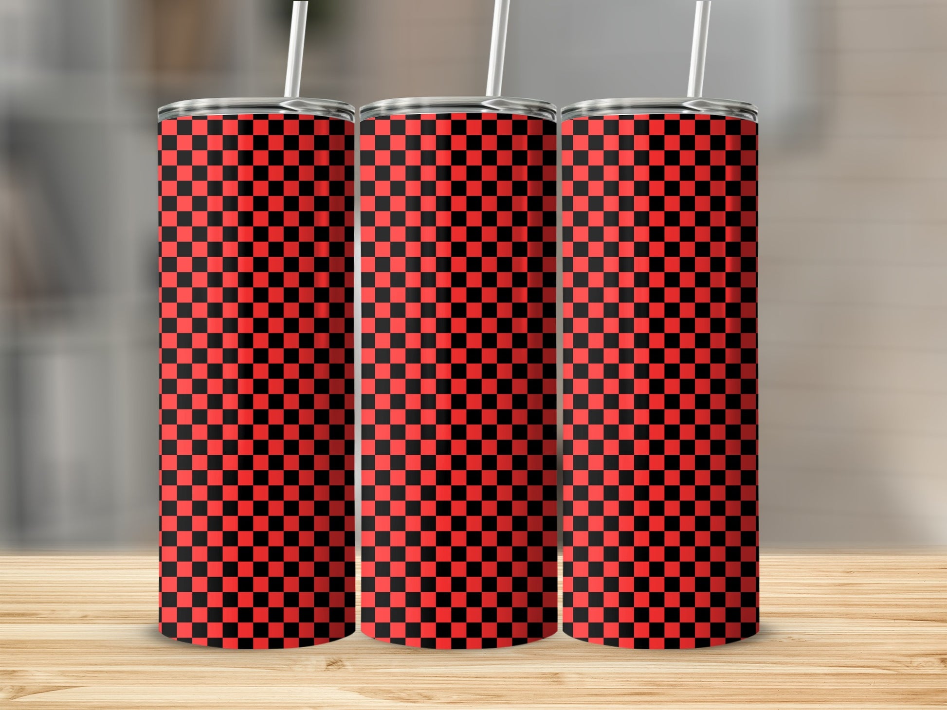 Three tall tumblers with a red and black checkered pattern.