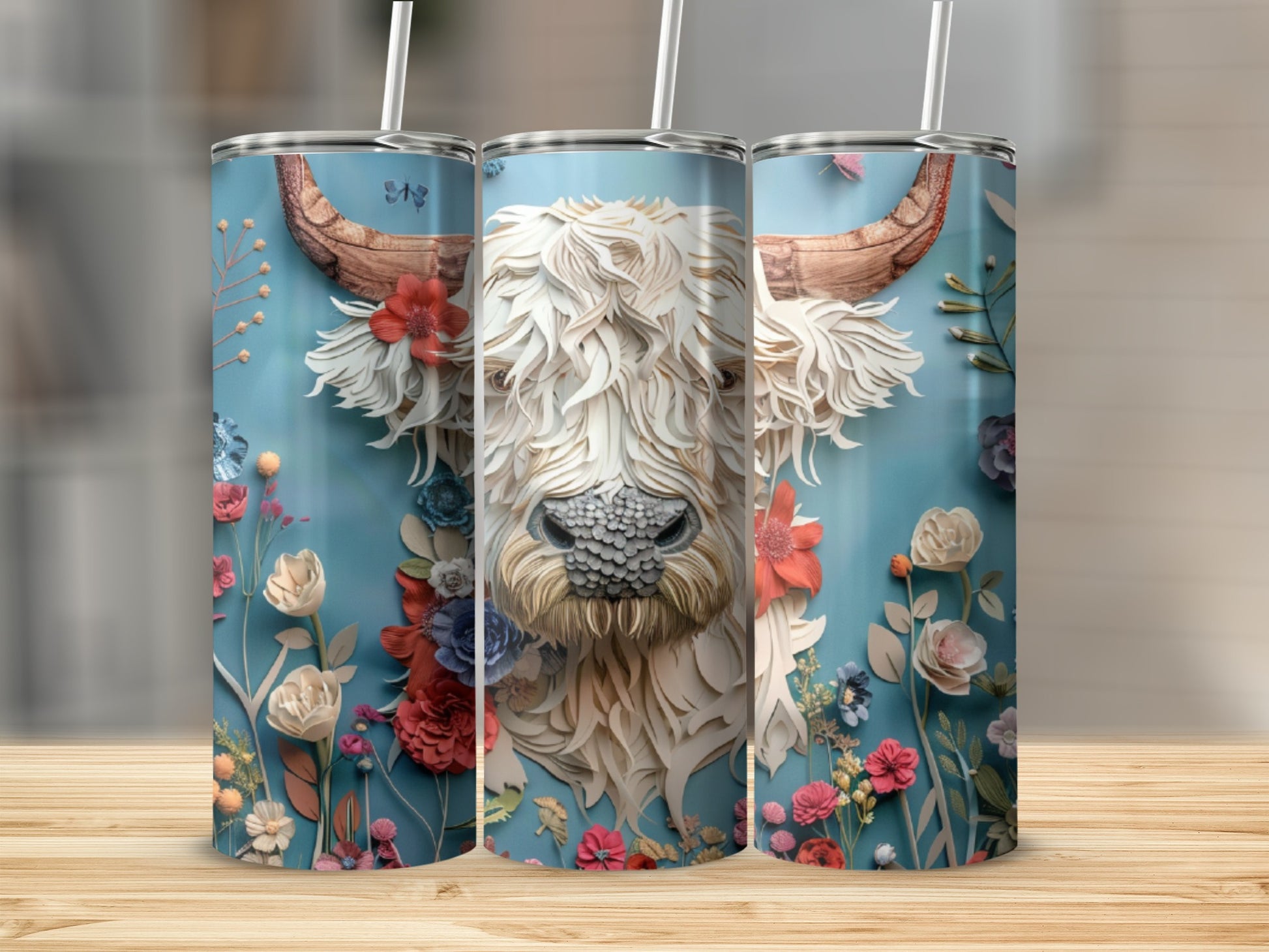 White Highland cow design on blue tumbler with floral accents.