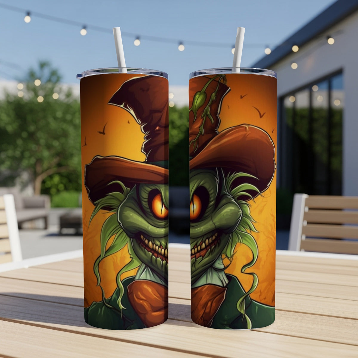 Two tumblers feature a spooky green monster with a wide grin and orange eyes.