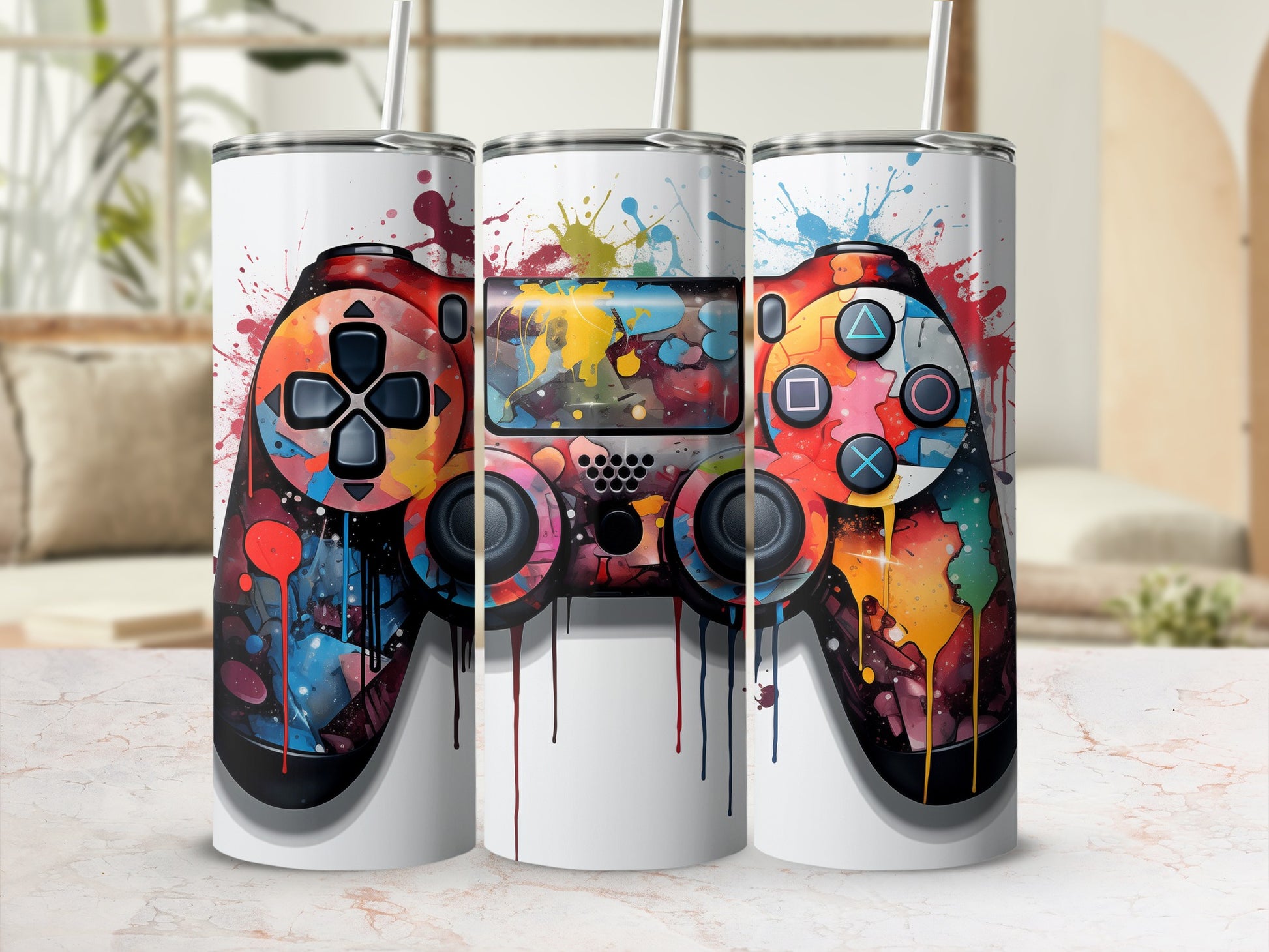 Three tumblers featuring a colorful, abstract video game controller design.