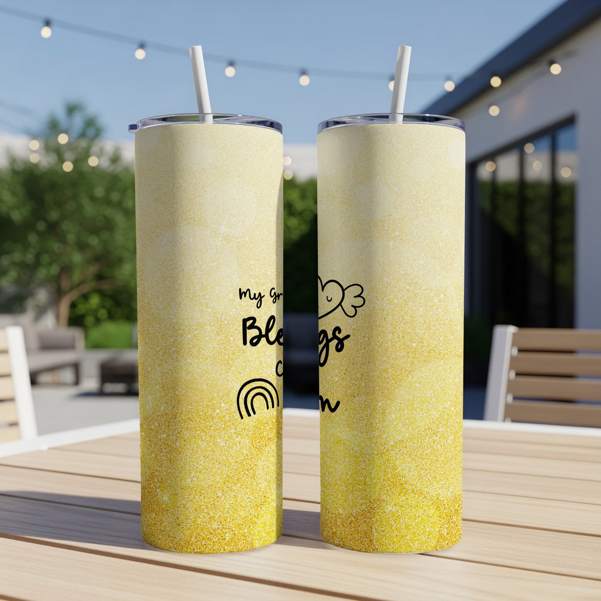 Two glittery tumblers with "my greatest blessings call me" and rainbow design.