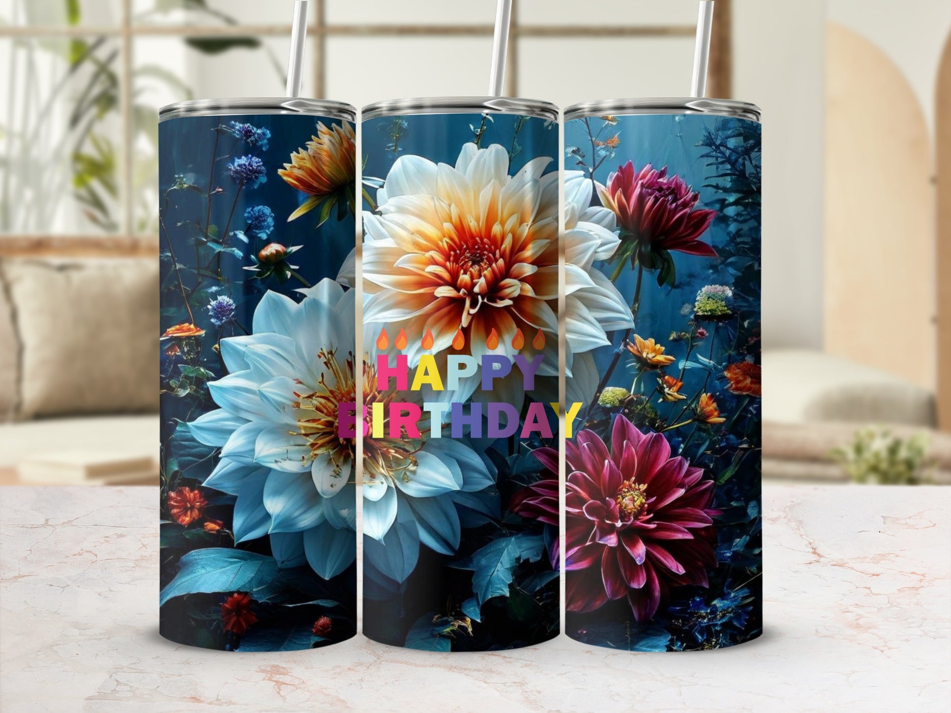Three tumblers with vibrant floral designs and "Happy Birthday" text.
