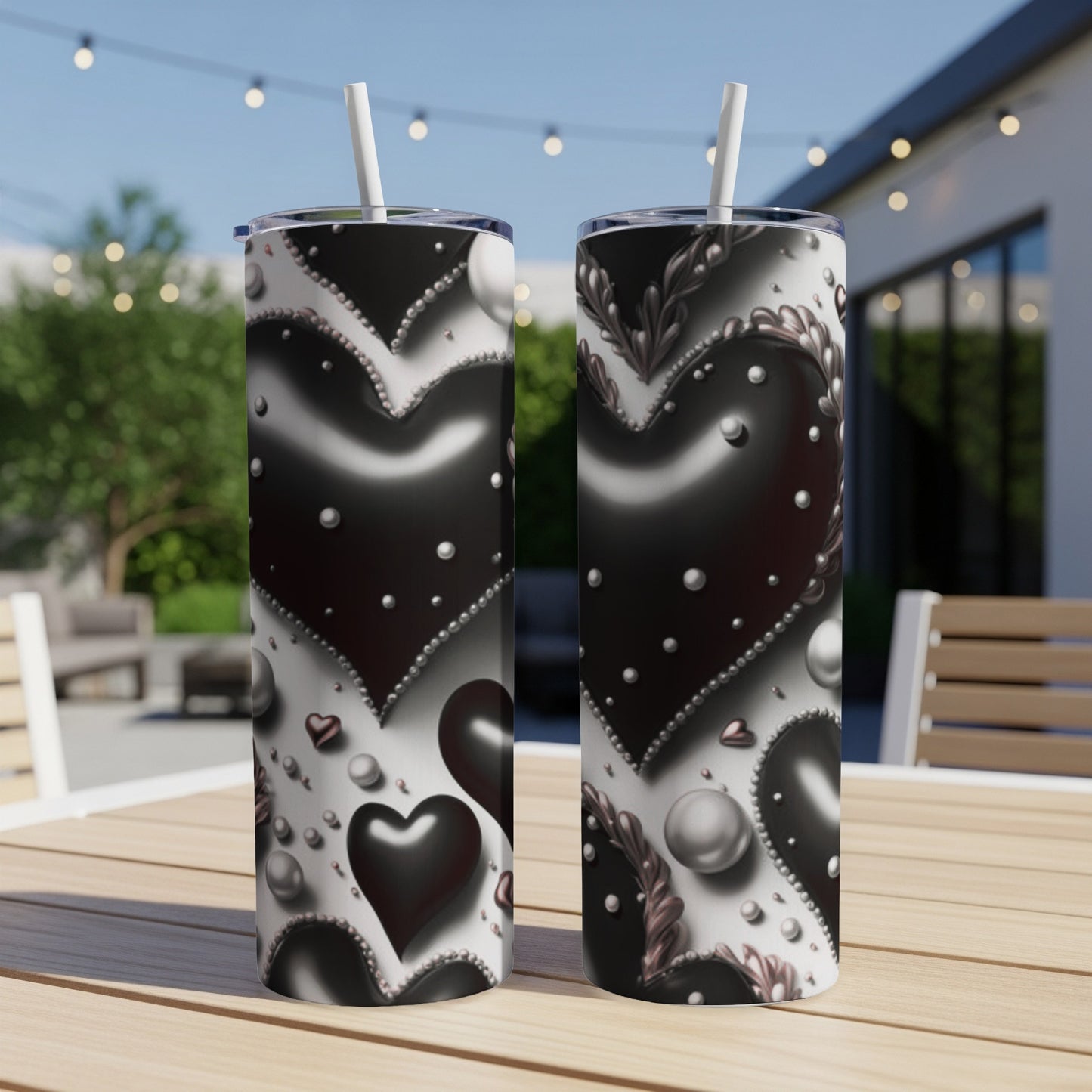 Two tumblers with black and silver hearts and pearl designs.